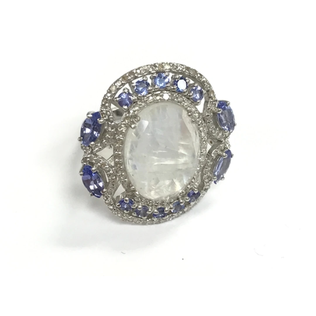 Silver dress ring set with oval moonstone pear and round tan...