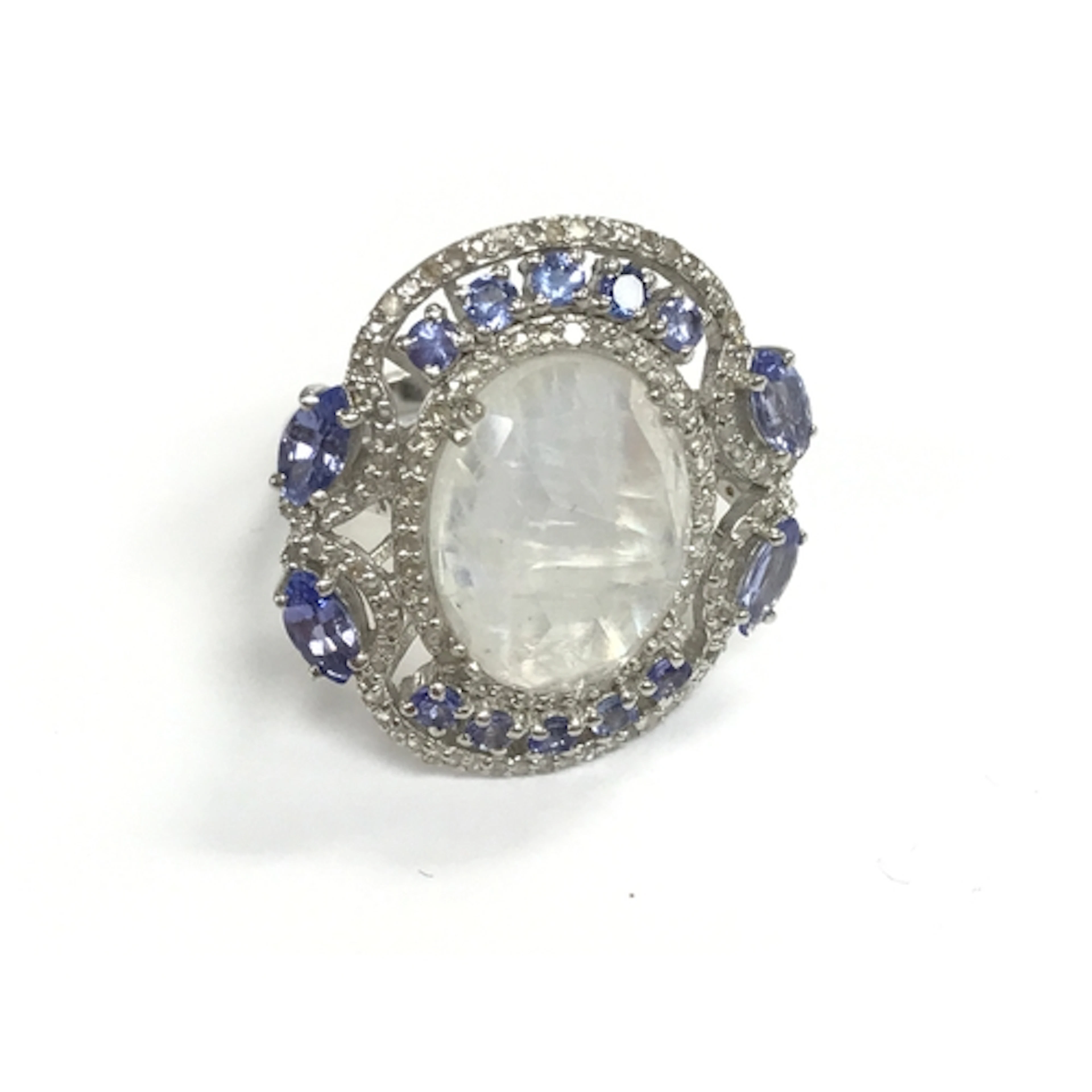 Silver dress ring set with oval moonstone pear and round tan...