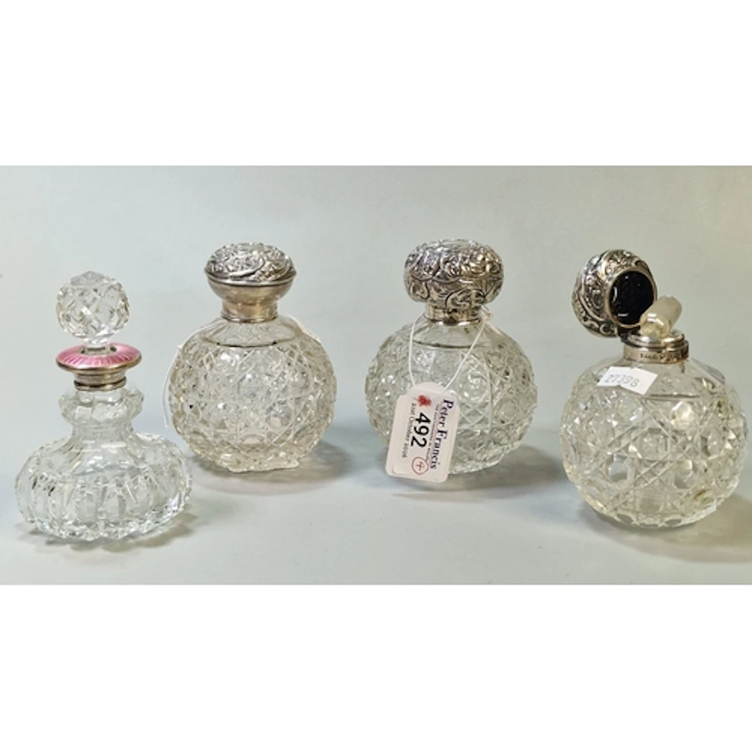Three similar globular hobnail cut glass scent bottles with ...