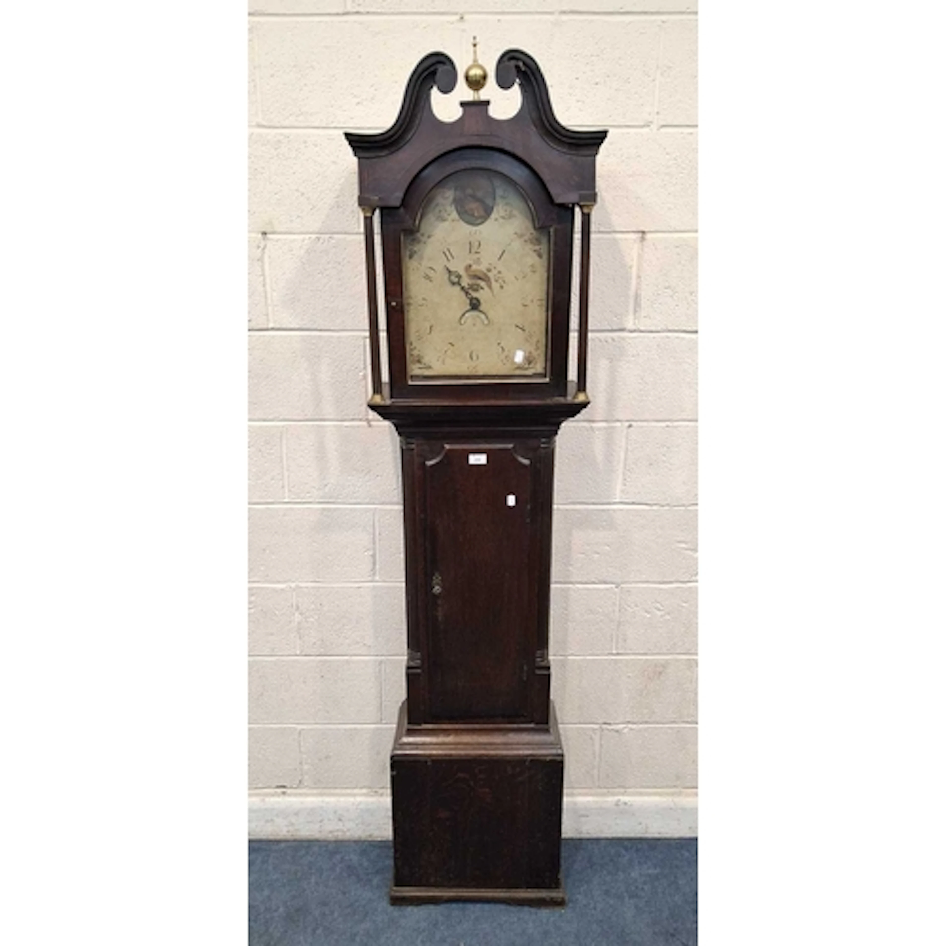 AN OAK CASED 30 HOUR LONGCASE CLOCK, with twin swan neck ped...