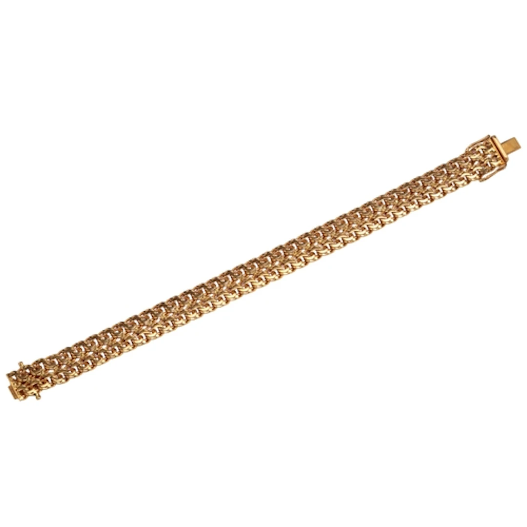 A gold bracelet, designed as a strap composed of flattened c...