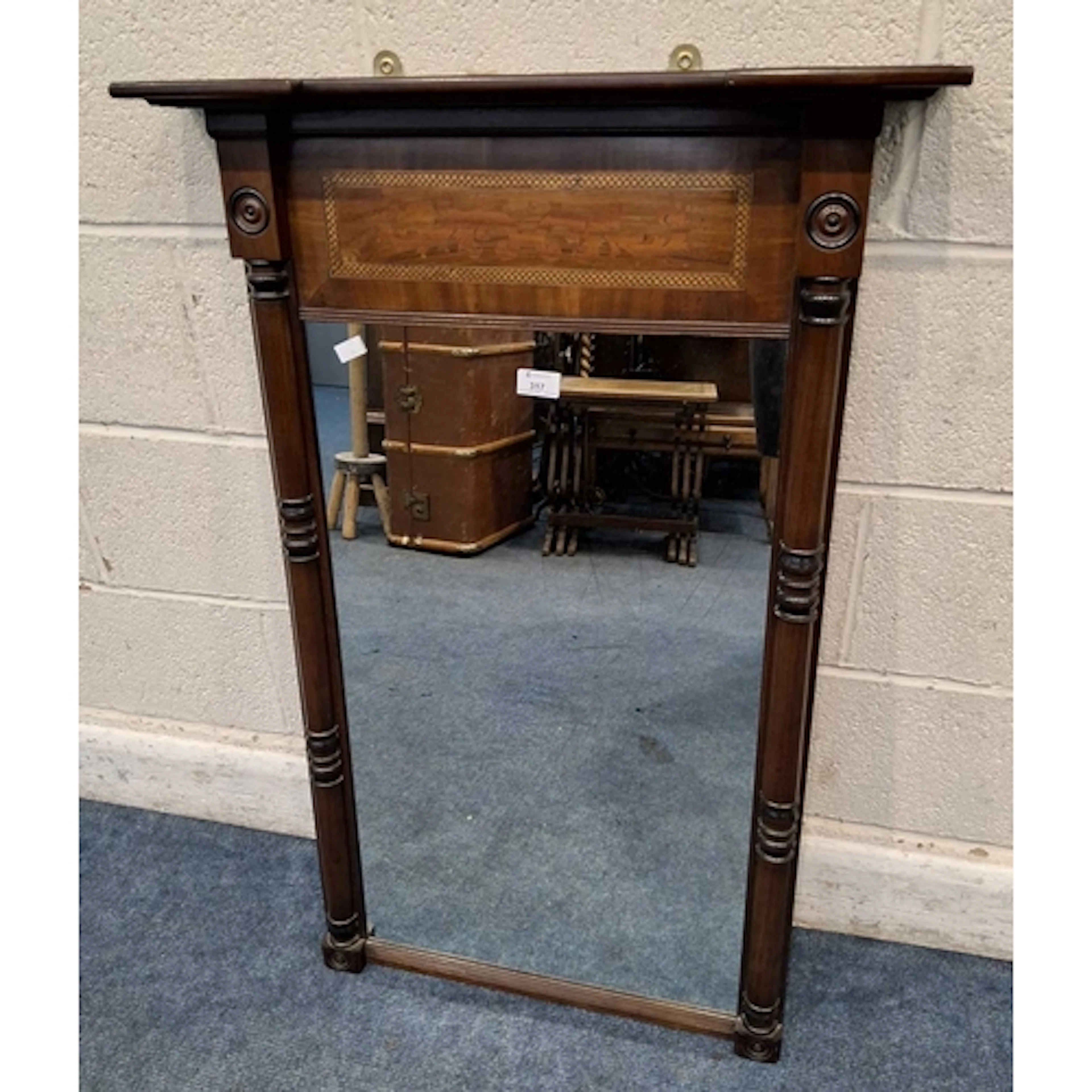 A REGENCY MAHOGANY PIER MIRROR, with marquetry inlay, turned...