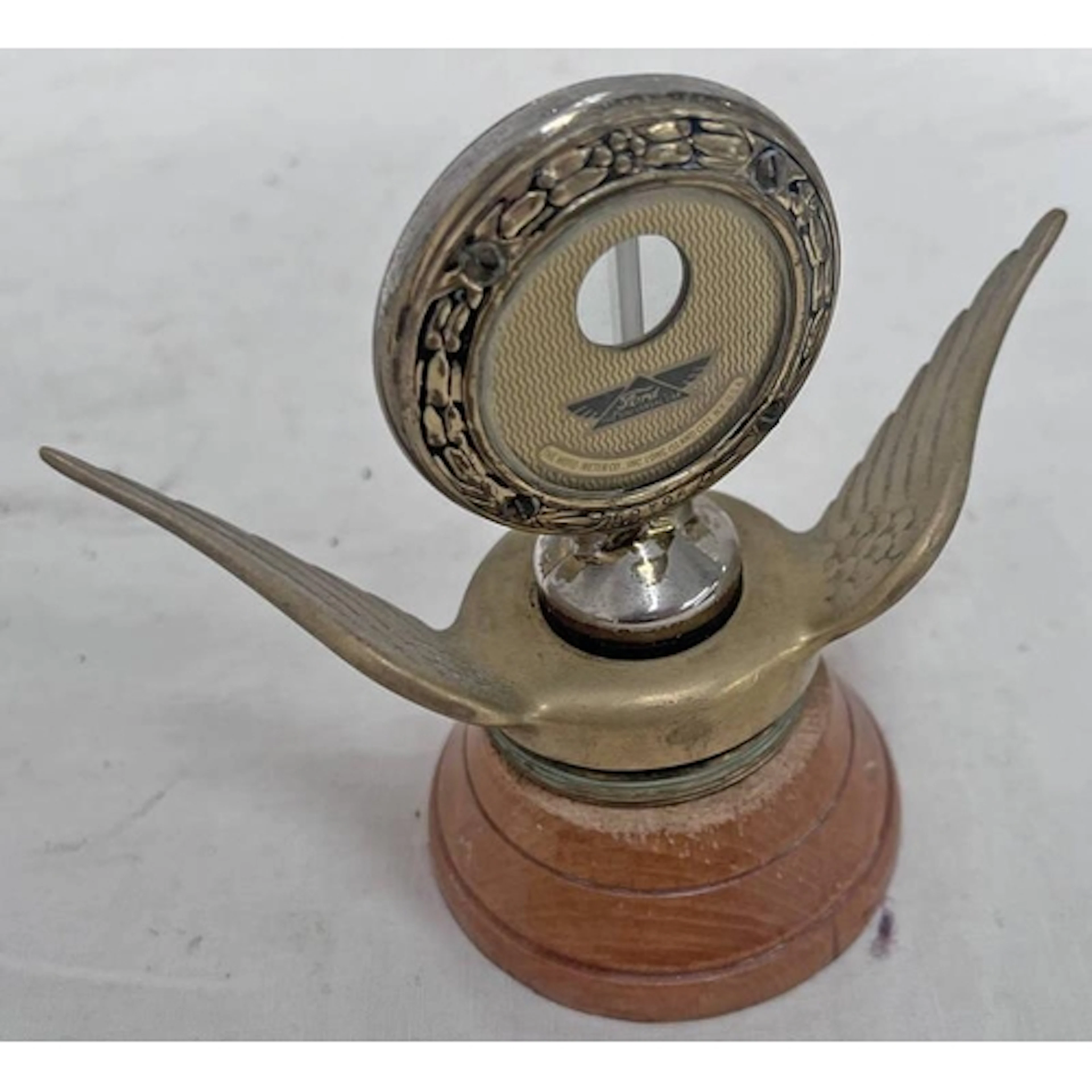 FORD BOYCE MOTO METER RADIATOR CAP ON A TURNED WOODEN BASE, ...