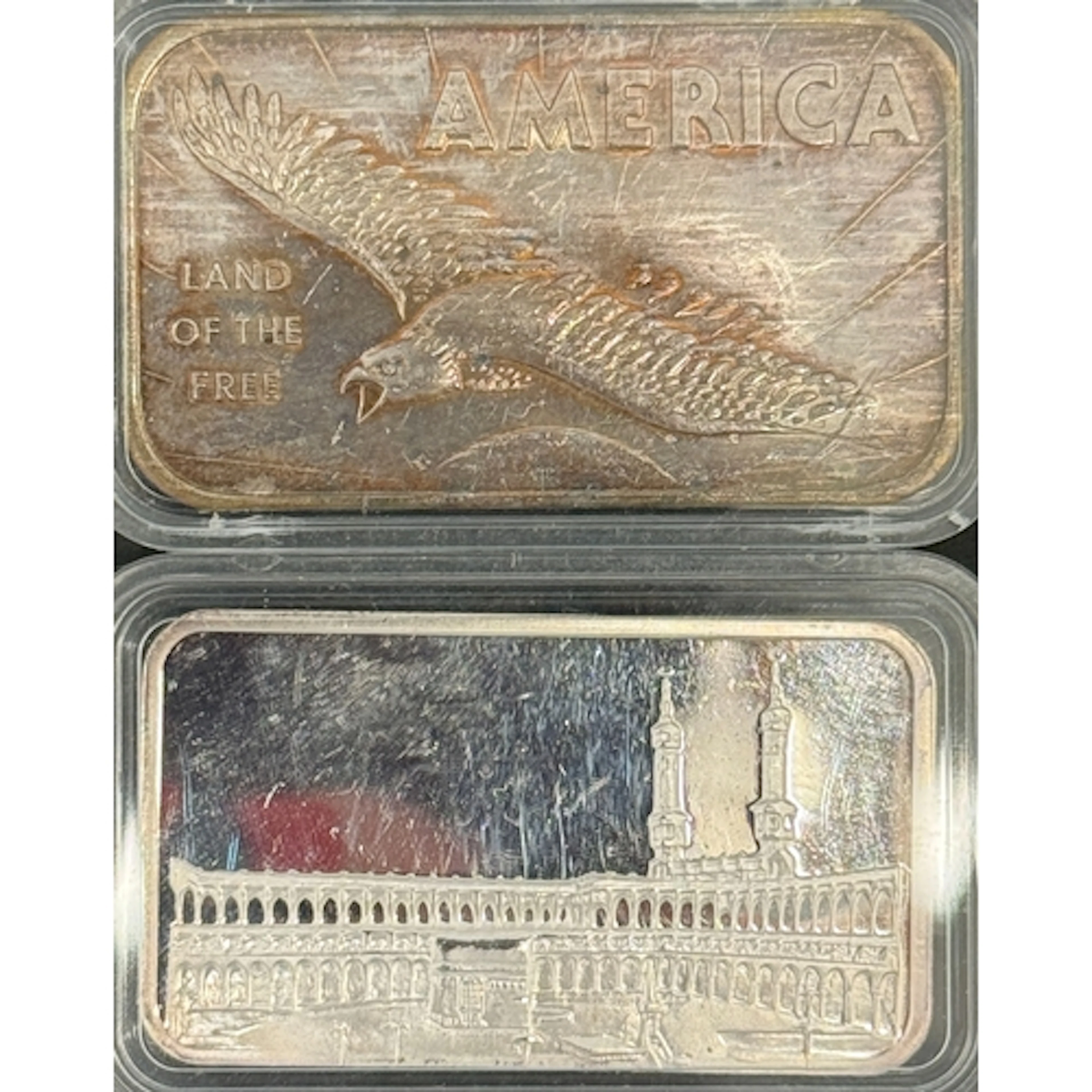 A pair of 1oz .999 fine silver ingots, comprising an America...