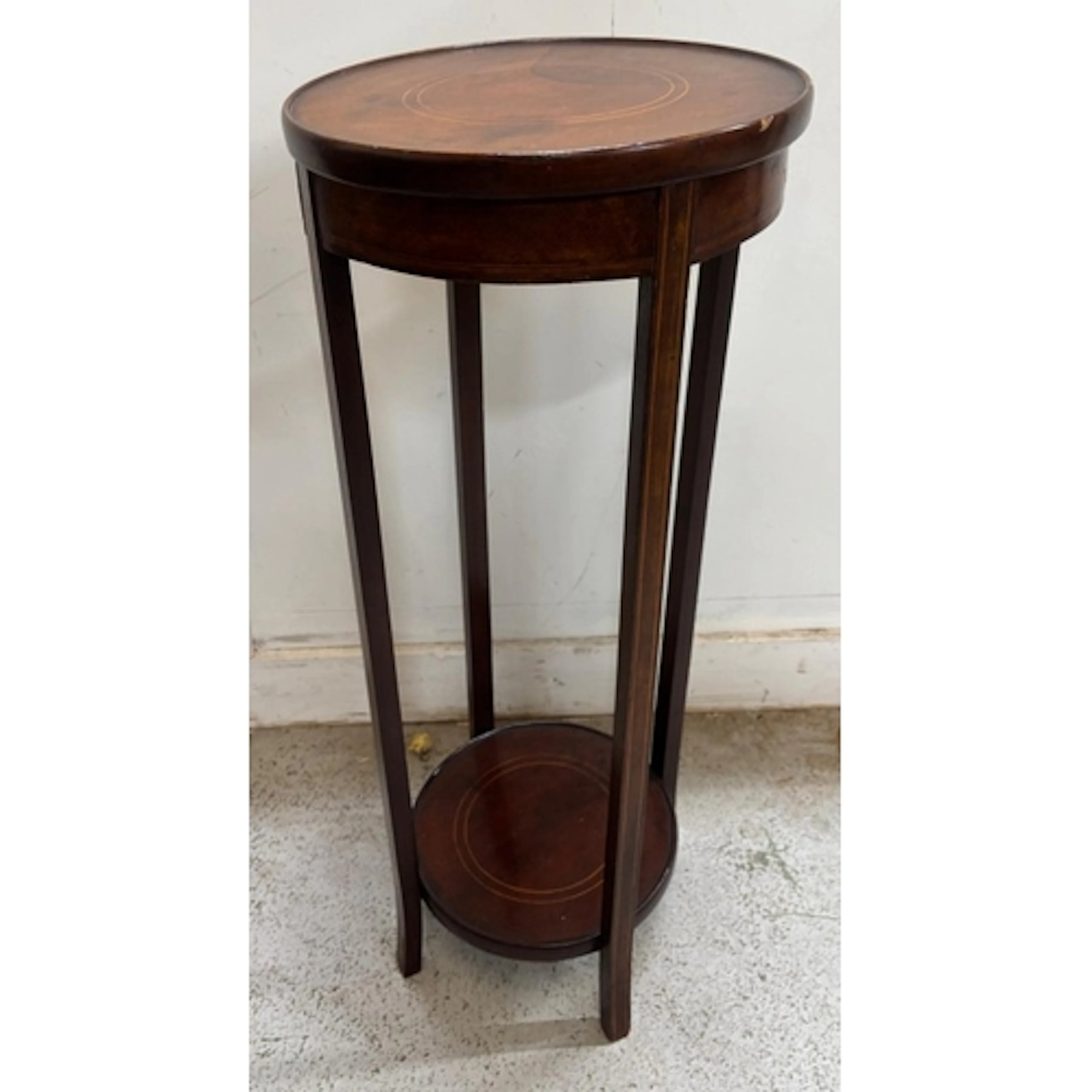 A mahogany plant stand with inlay to top H80cm Dia32cm...