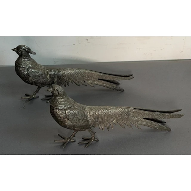 Two white metal ornamental pheasants.