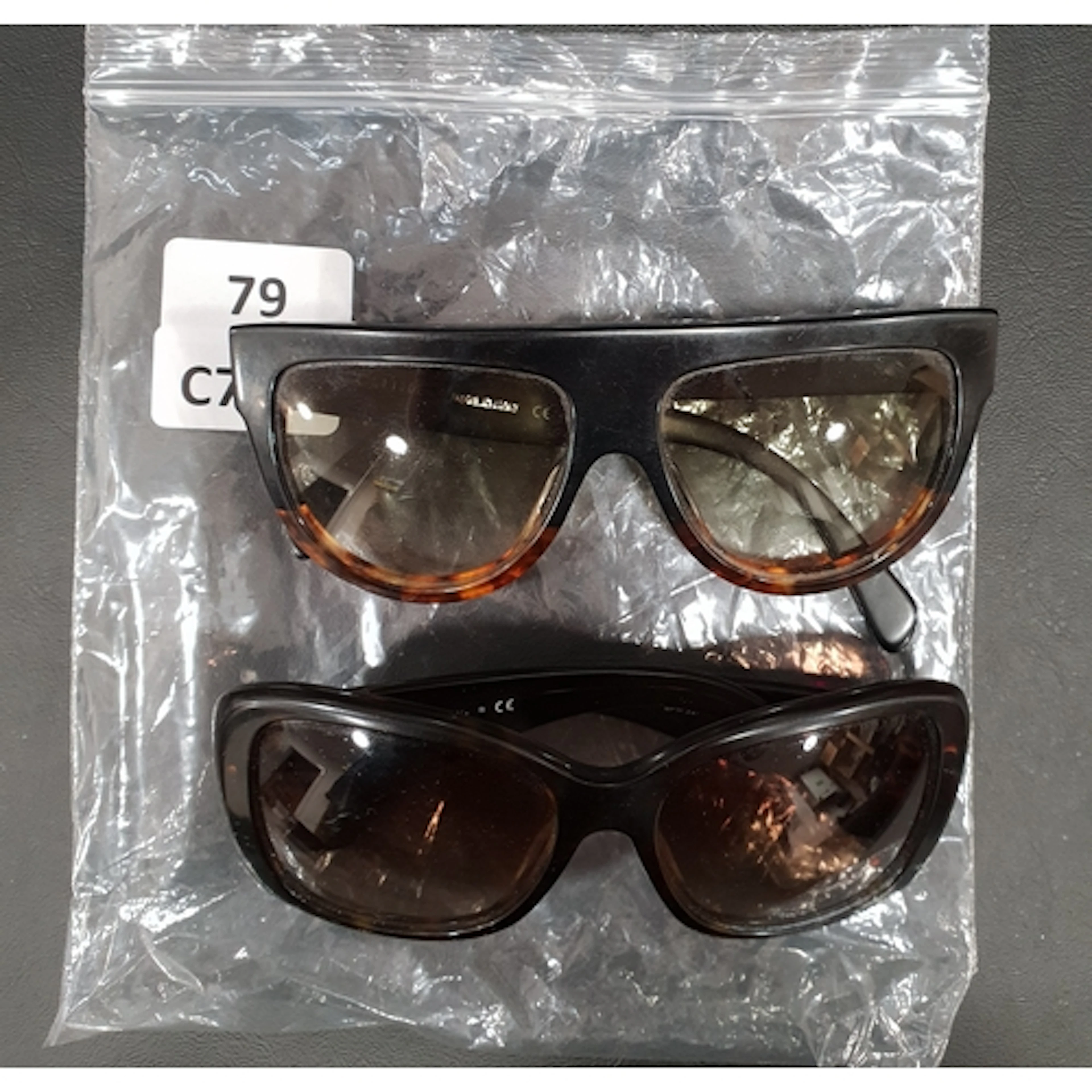 TWO PAIRS OF SUNGLASSES comprising Prada model SPR 32P, and ...