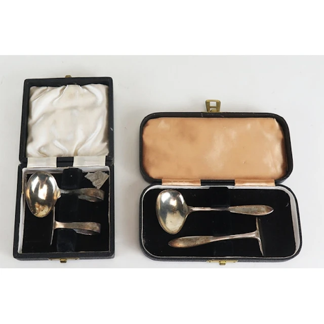 Two silver christening sets, various makers and dates, cased...