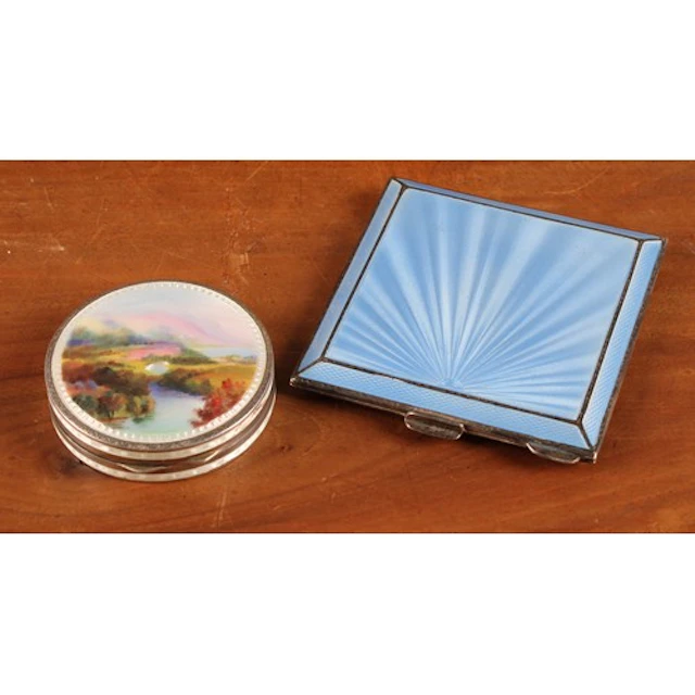 An Art Deco silver and blue guilloche enamel powder compact,...