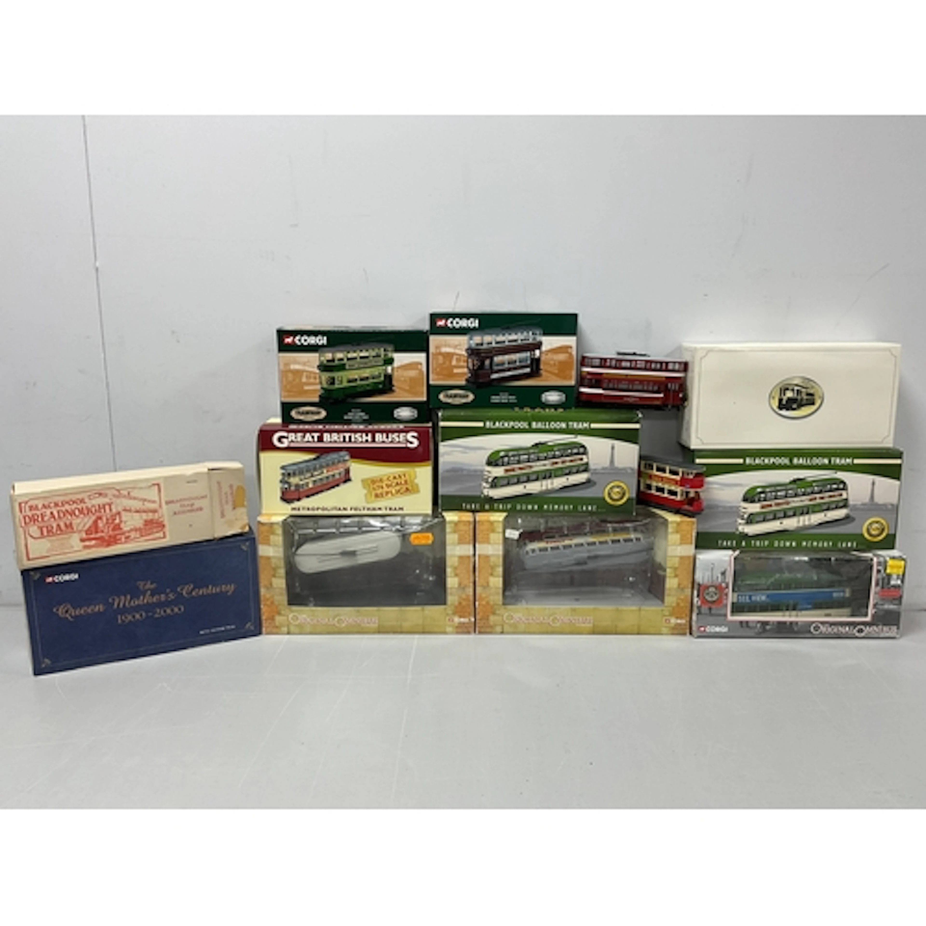 Twelve Diecast and plastic model trams by Corgi, Atlas, Matc...