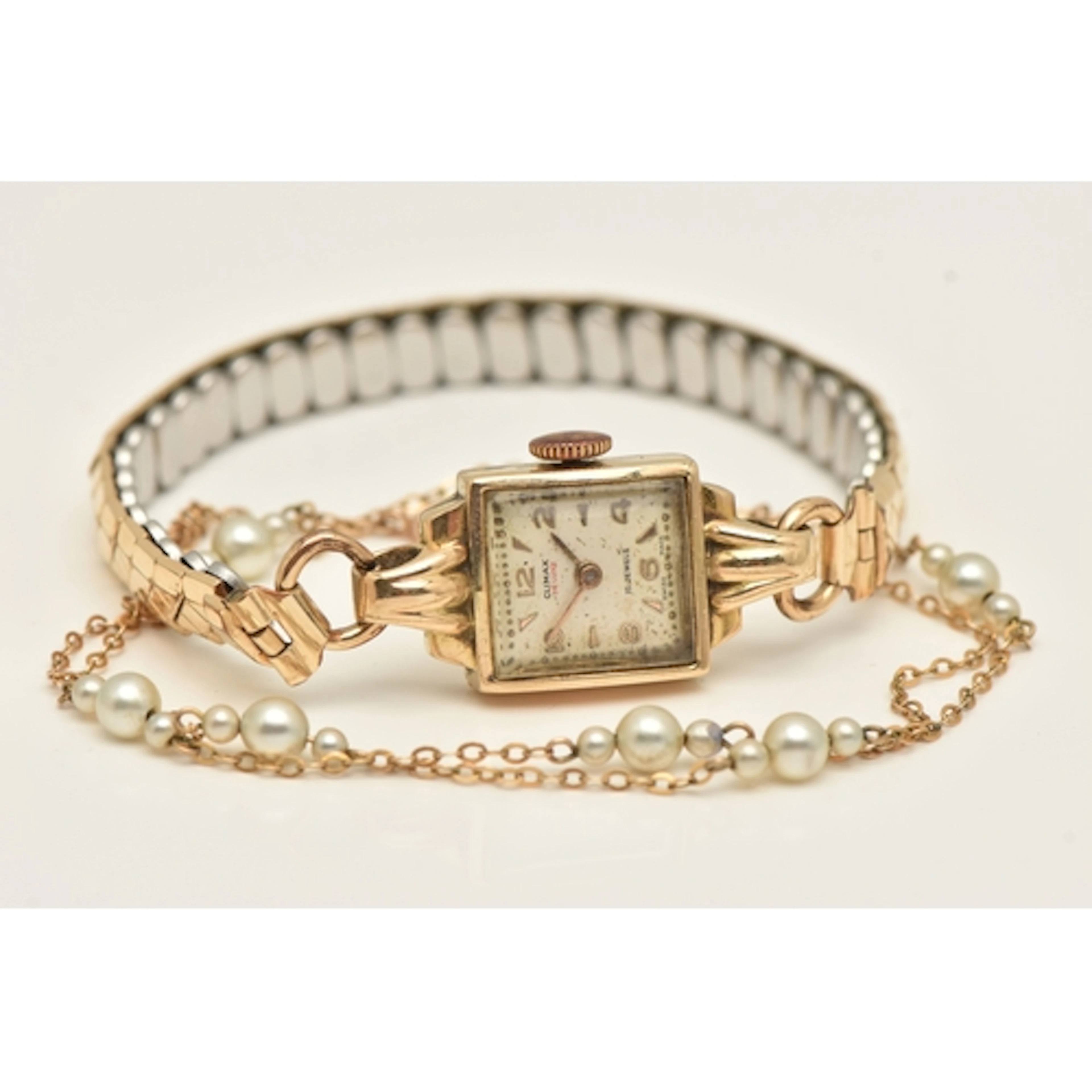 A LADIES 9CT GOLD WRISTWATCH AND A YELLOW METAL CHAIN NECKLA...