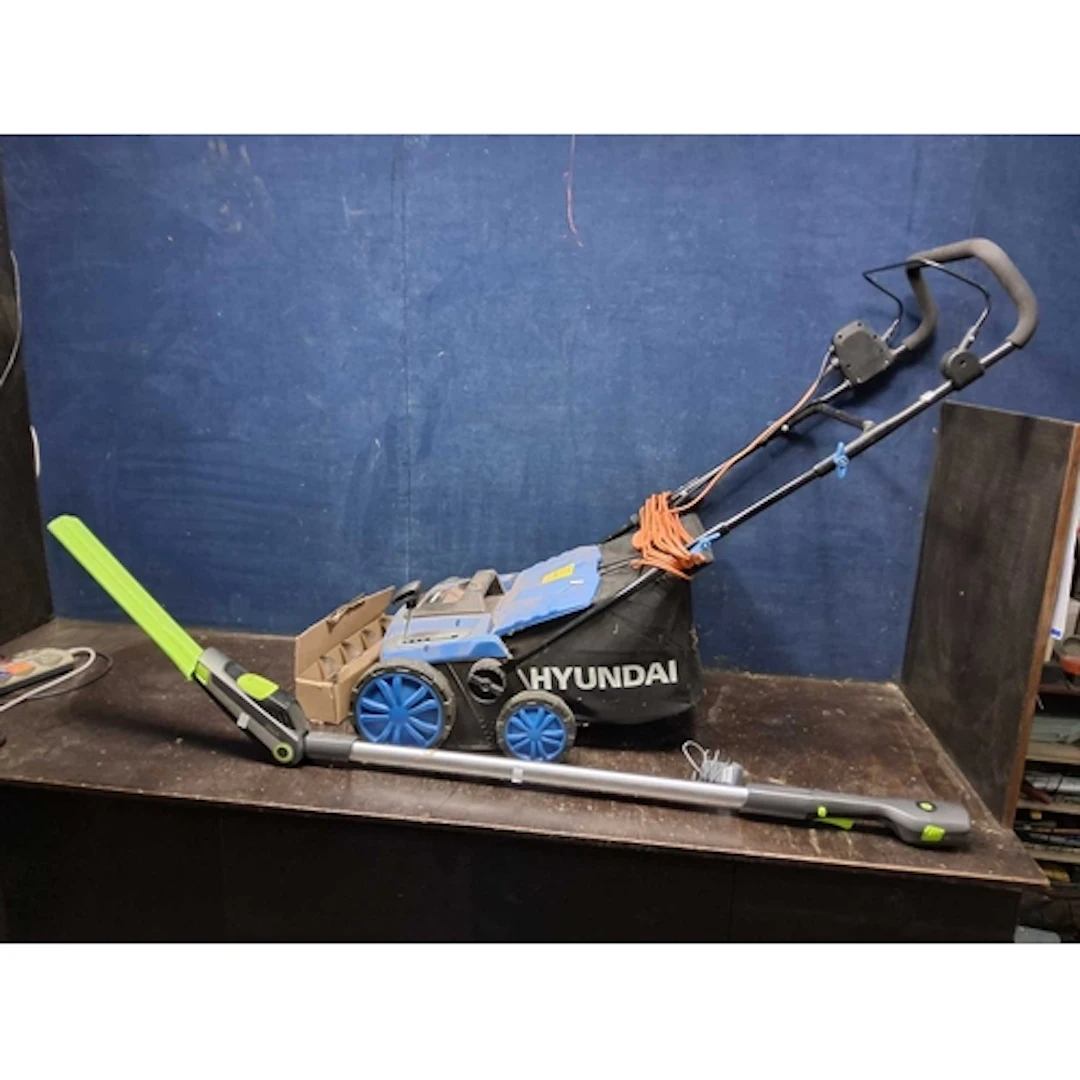 A HYUNDAI SCARIFIER with airater attachment and grass box al...