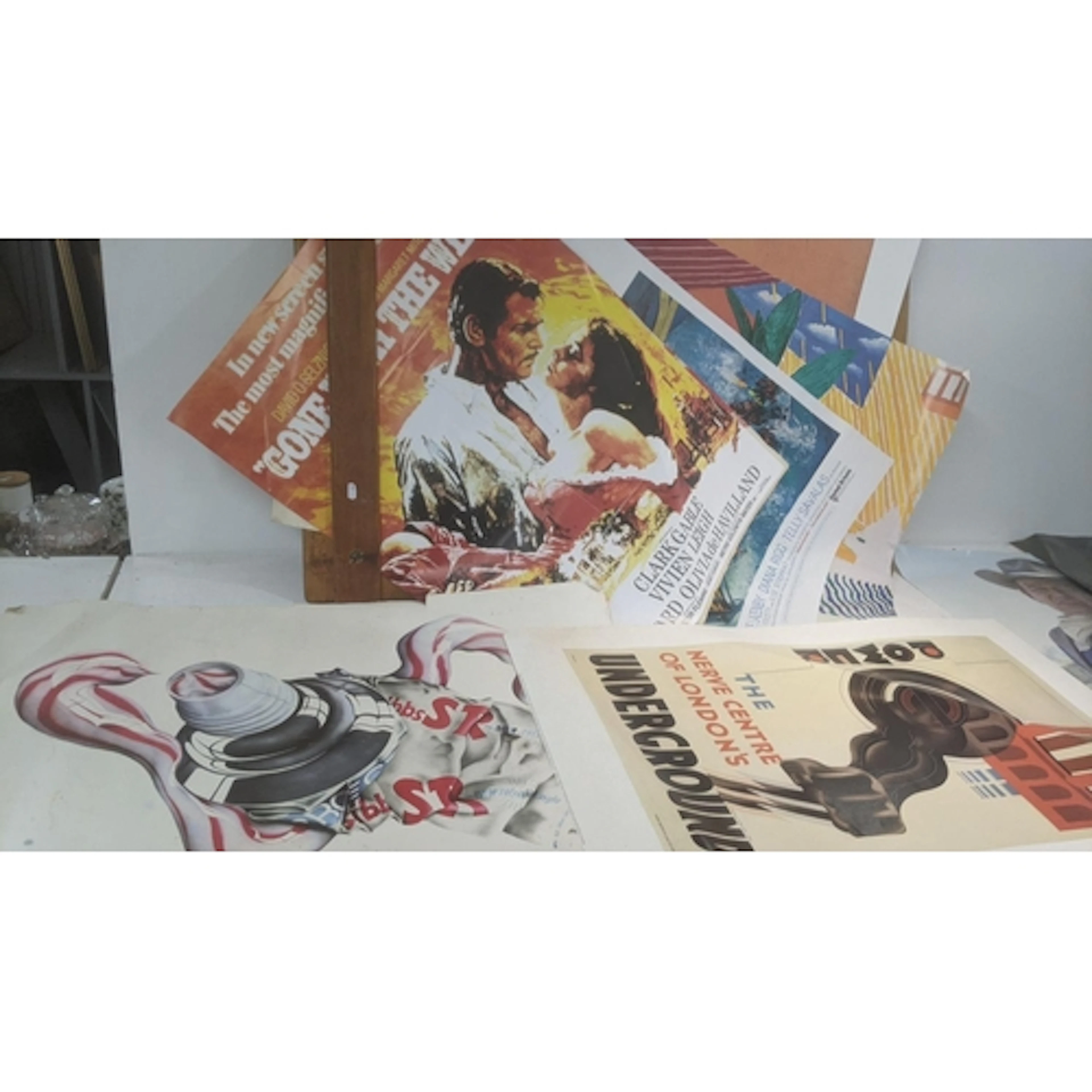 A portfolio of posters to include a reproduction 'Gone with ...