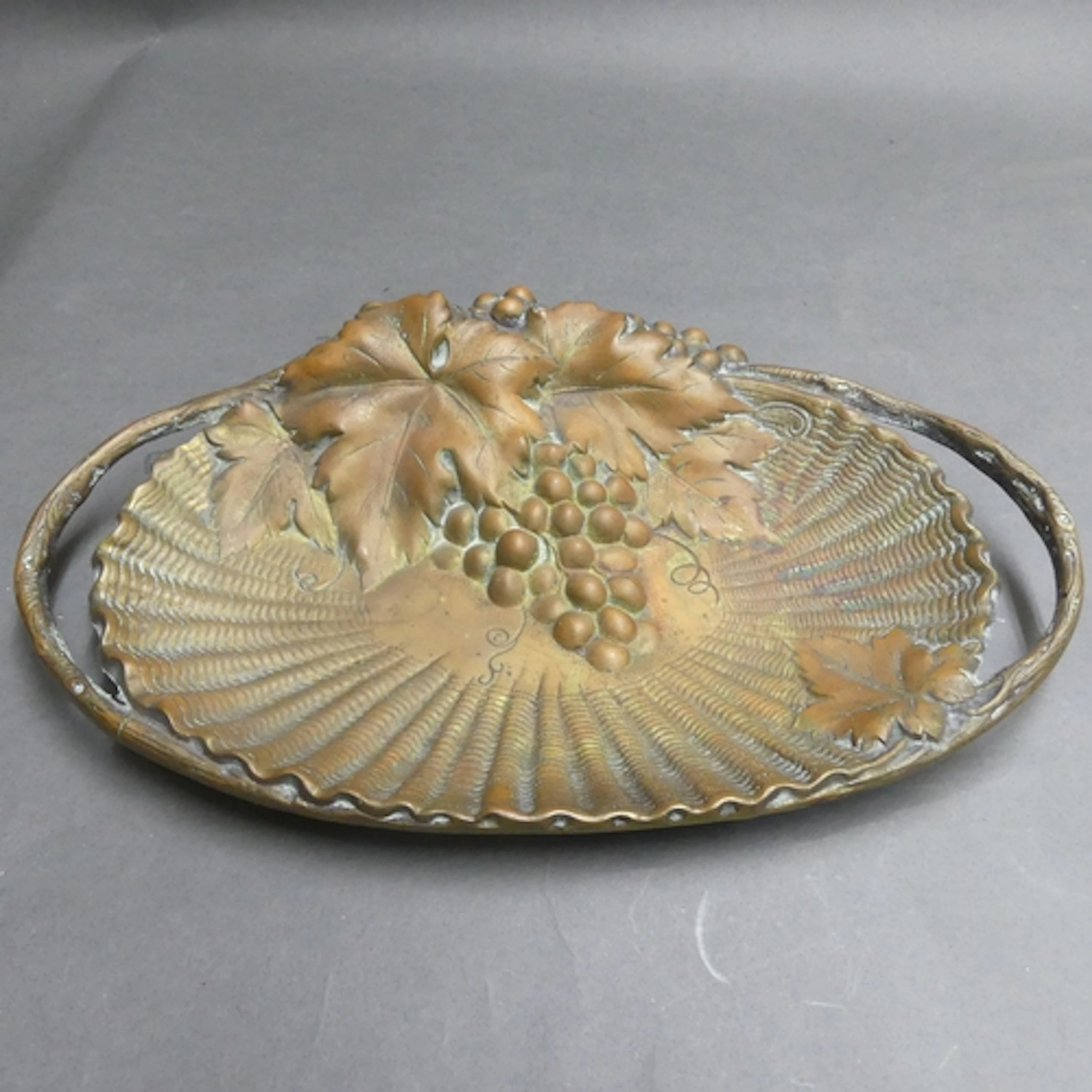 An Art Nouveau bronze twin handled serving dish in the style...