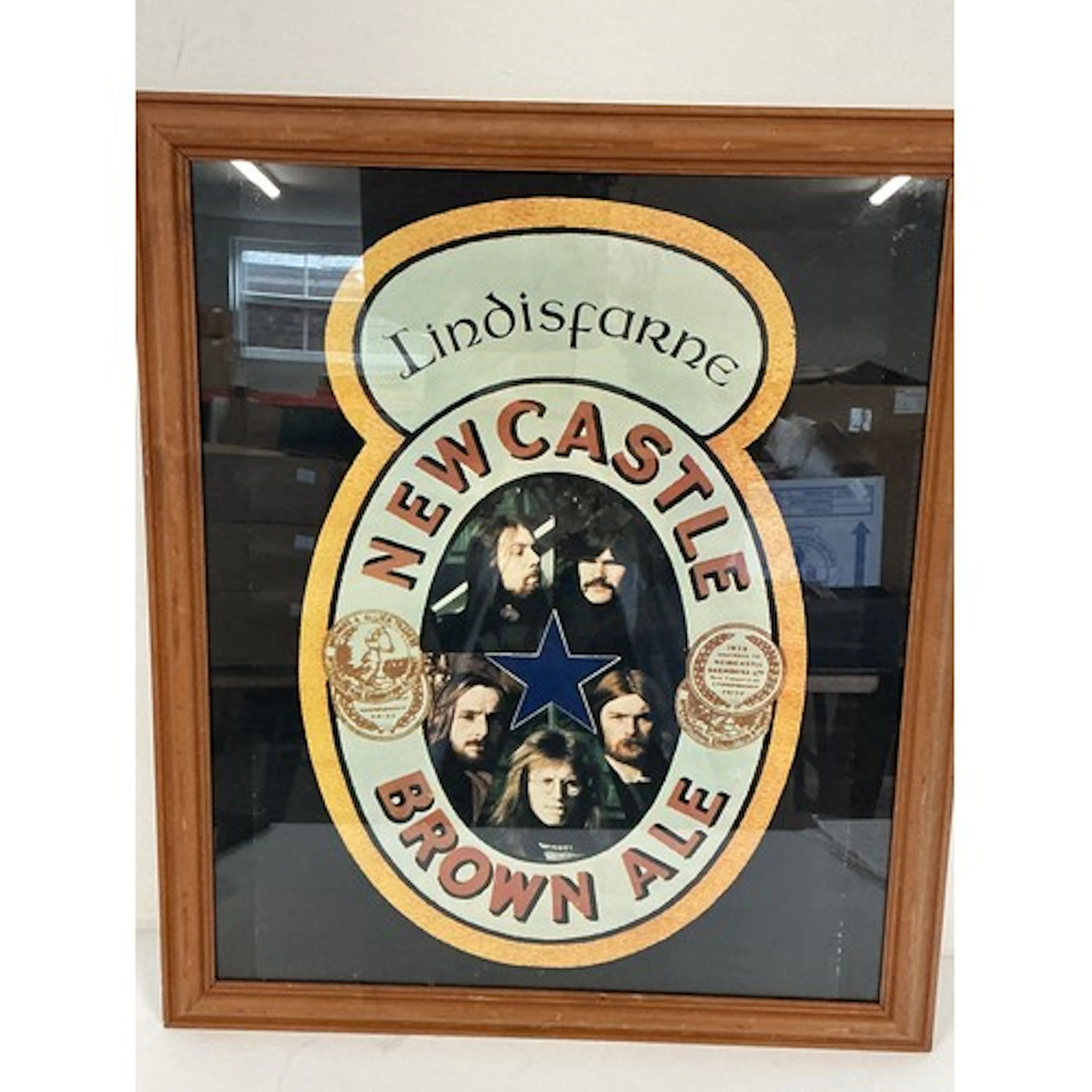 A framed and glazed early 1970s Lindisfarne Newcastle Brown ...