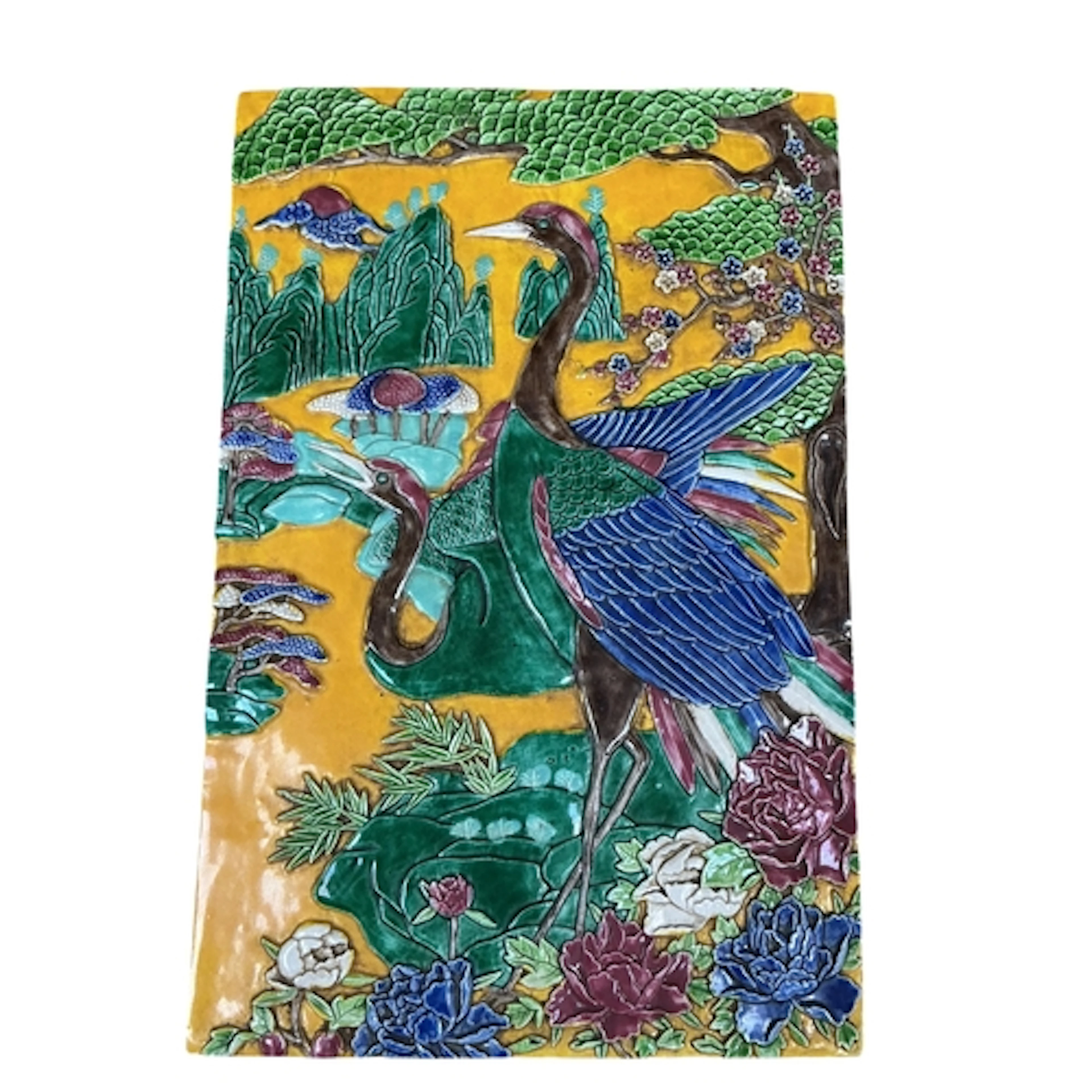 A Chinese polychrome relief moulded tile, decorated with two...