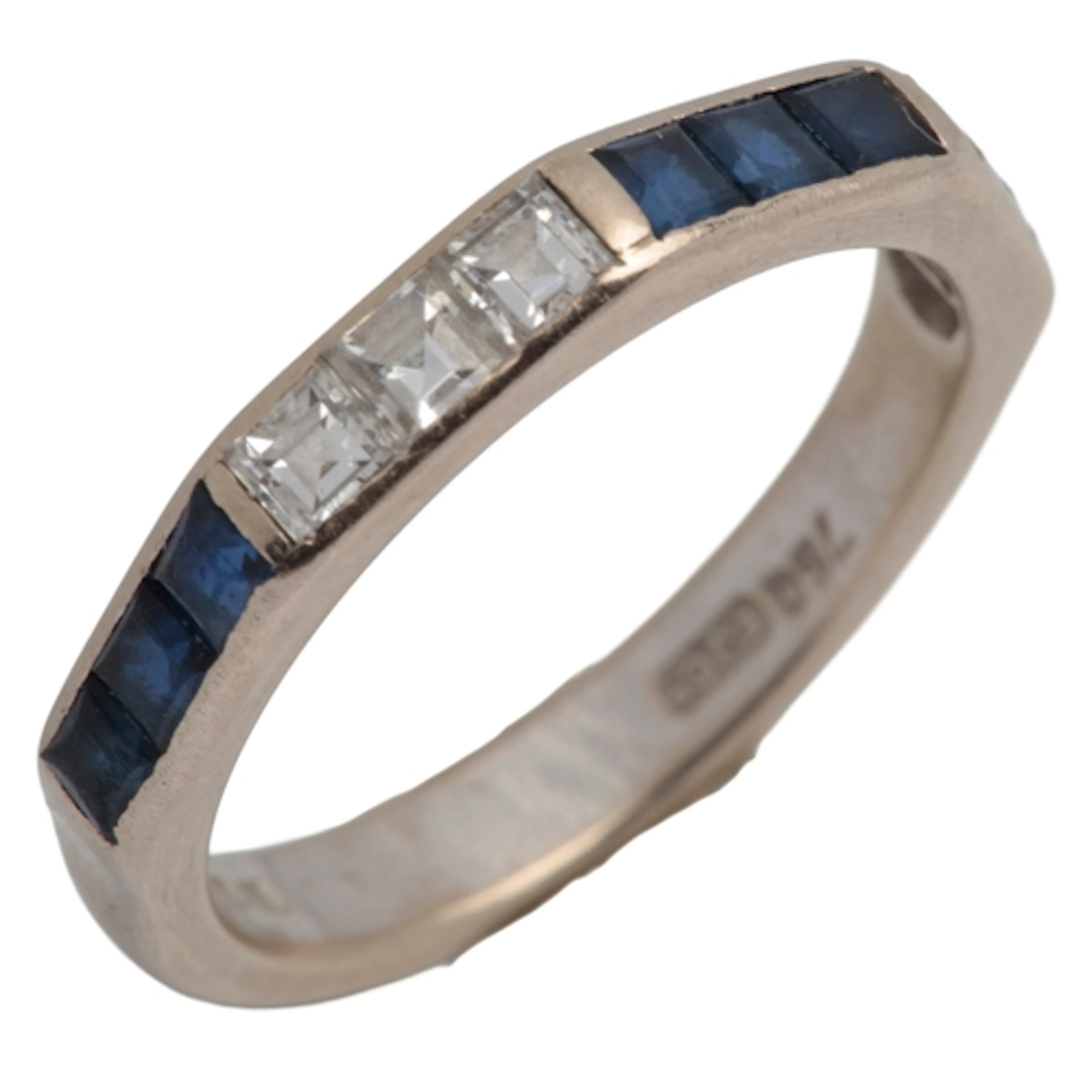 A sapphire and diamond half eternity ring, circa 1974, the f...