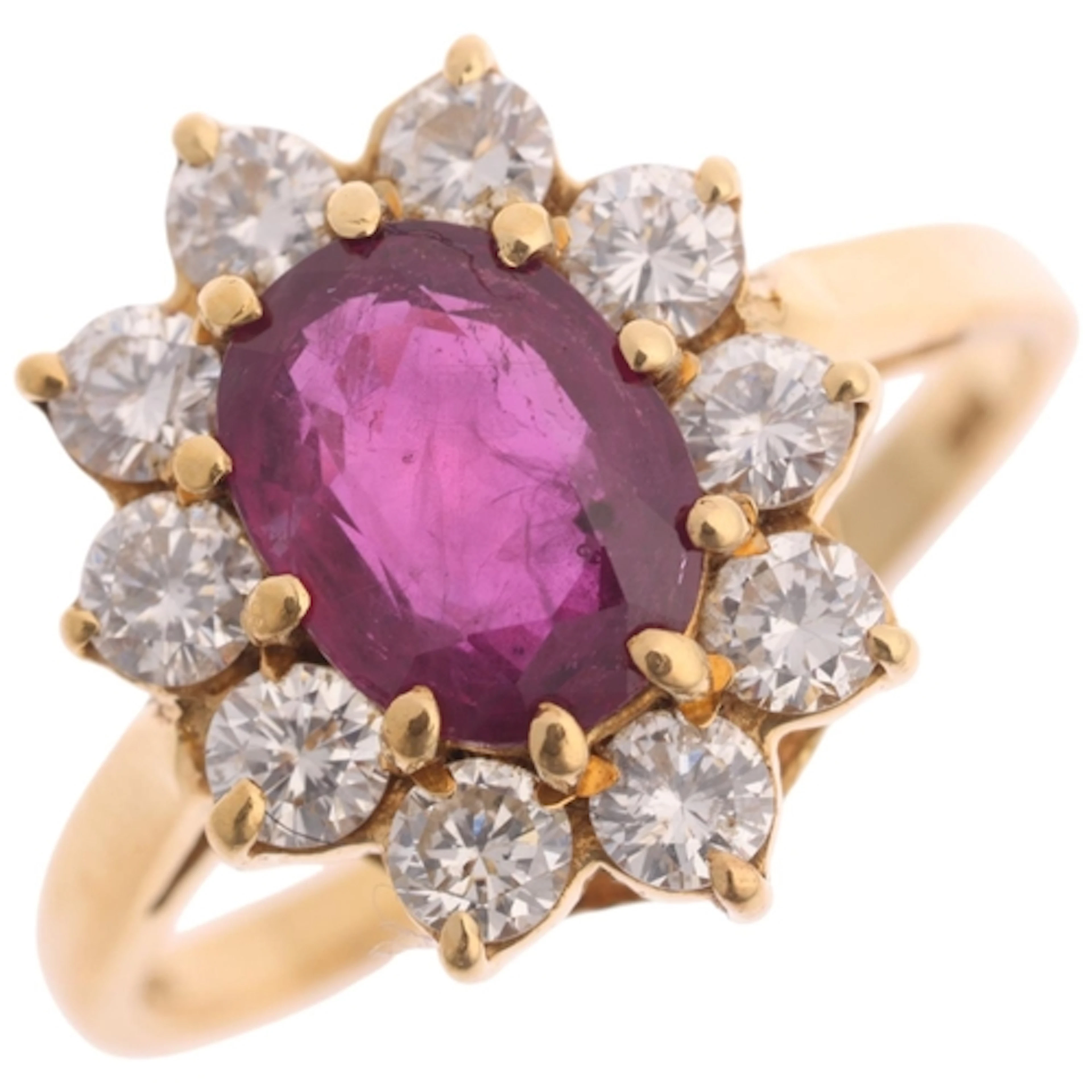 An 18ct gold ruby and diamond cluster ring, maker MJ, import...