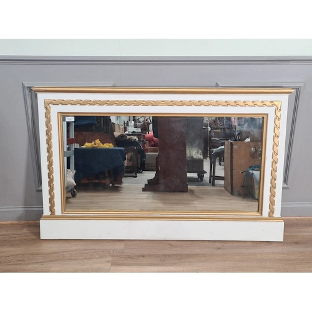 A white and gilt painted overmantel Mirror.
