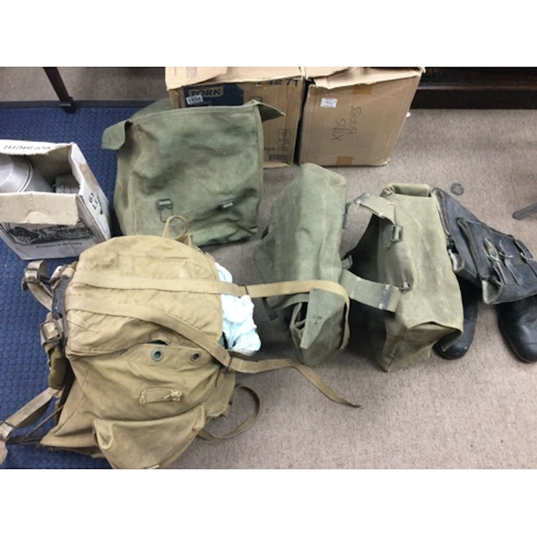 Collection of military gear and biker boots and and panniers