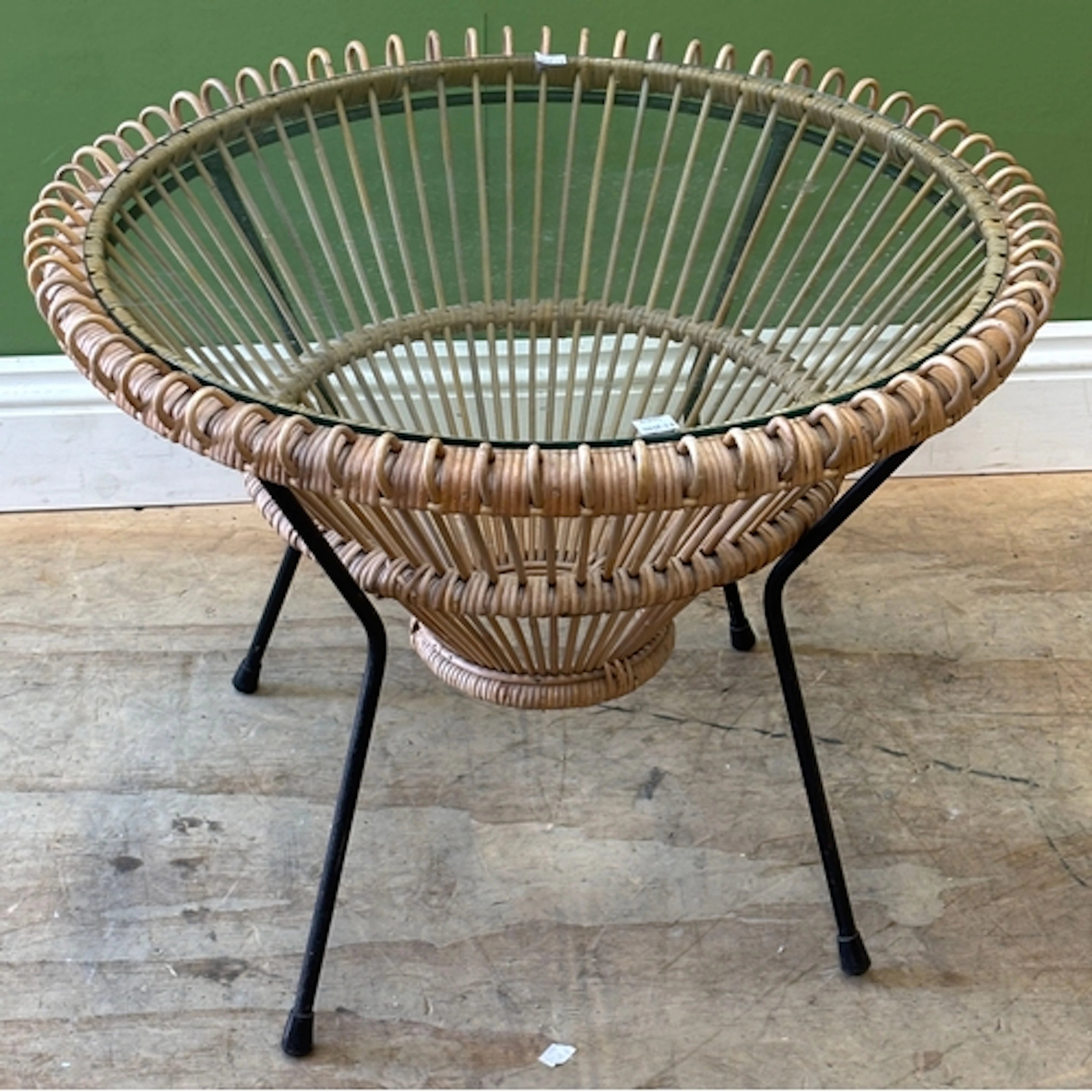 A Franco Albini wicker circular coffee table with glass top,...