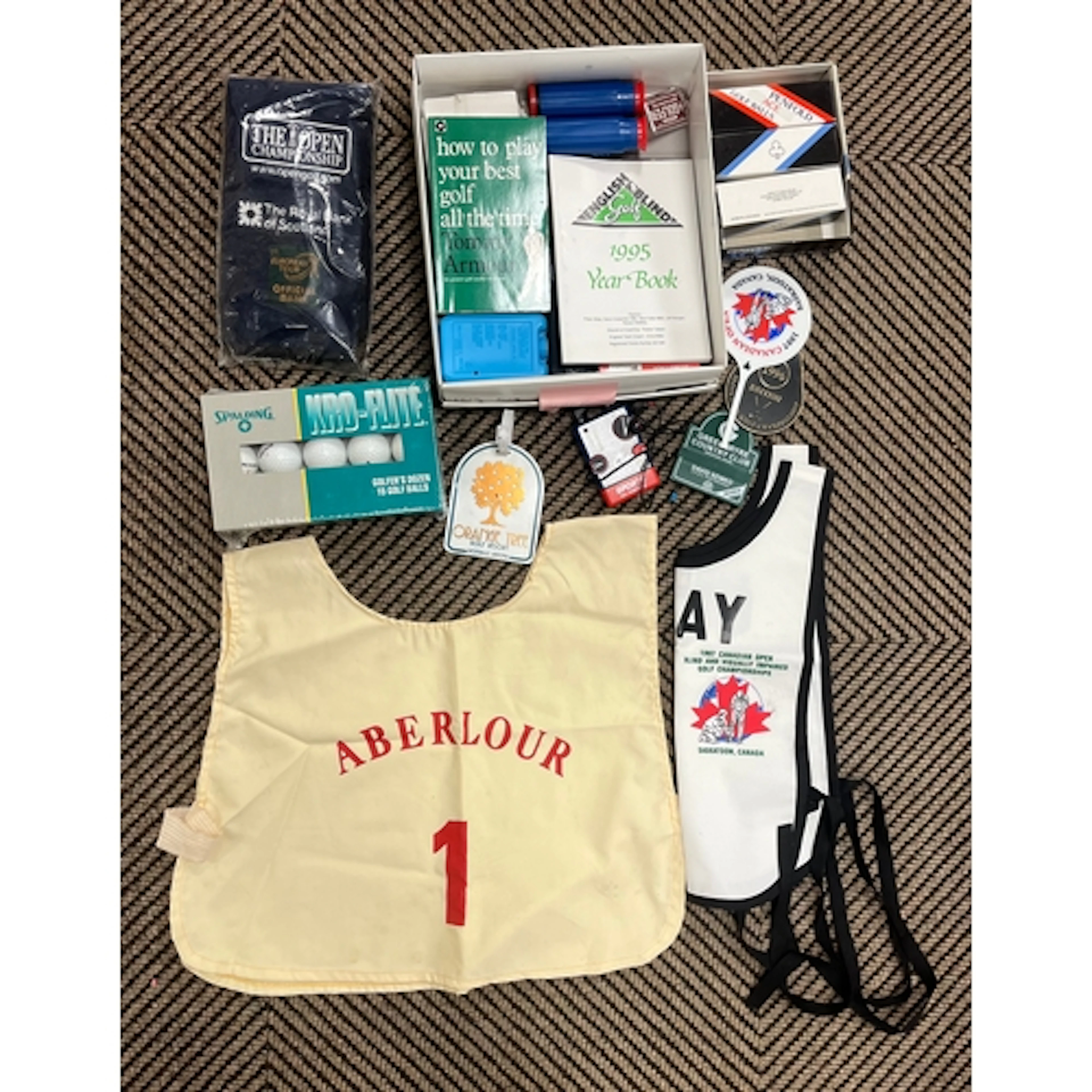 Collection of Golf memorabilia, to include Caddy bibs, gold ...