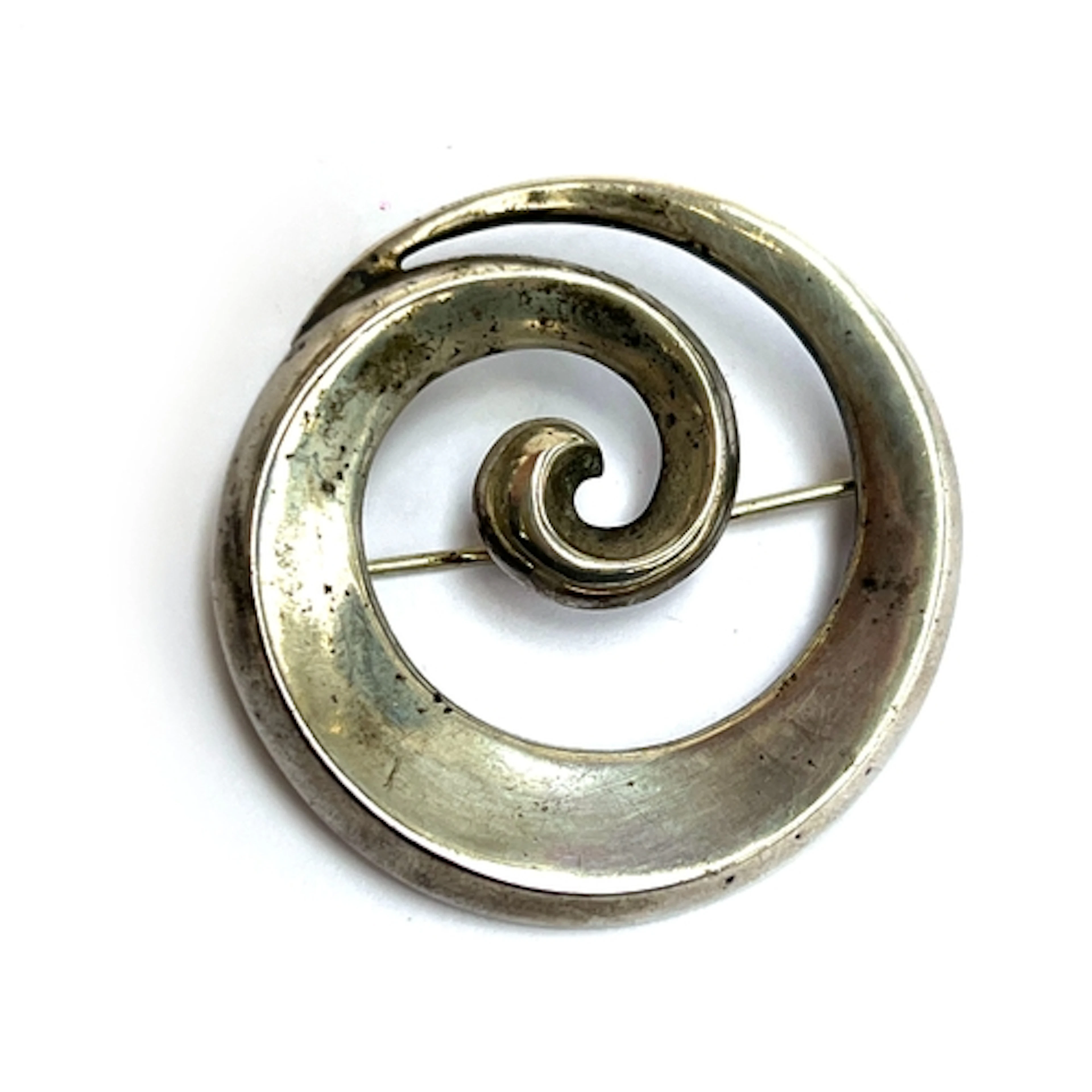 Just Andersen, a modernist silver swirl brooch, stamped 'Jus...