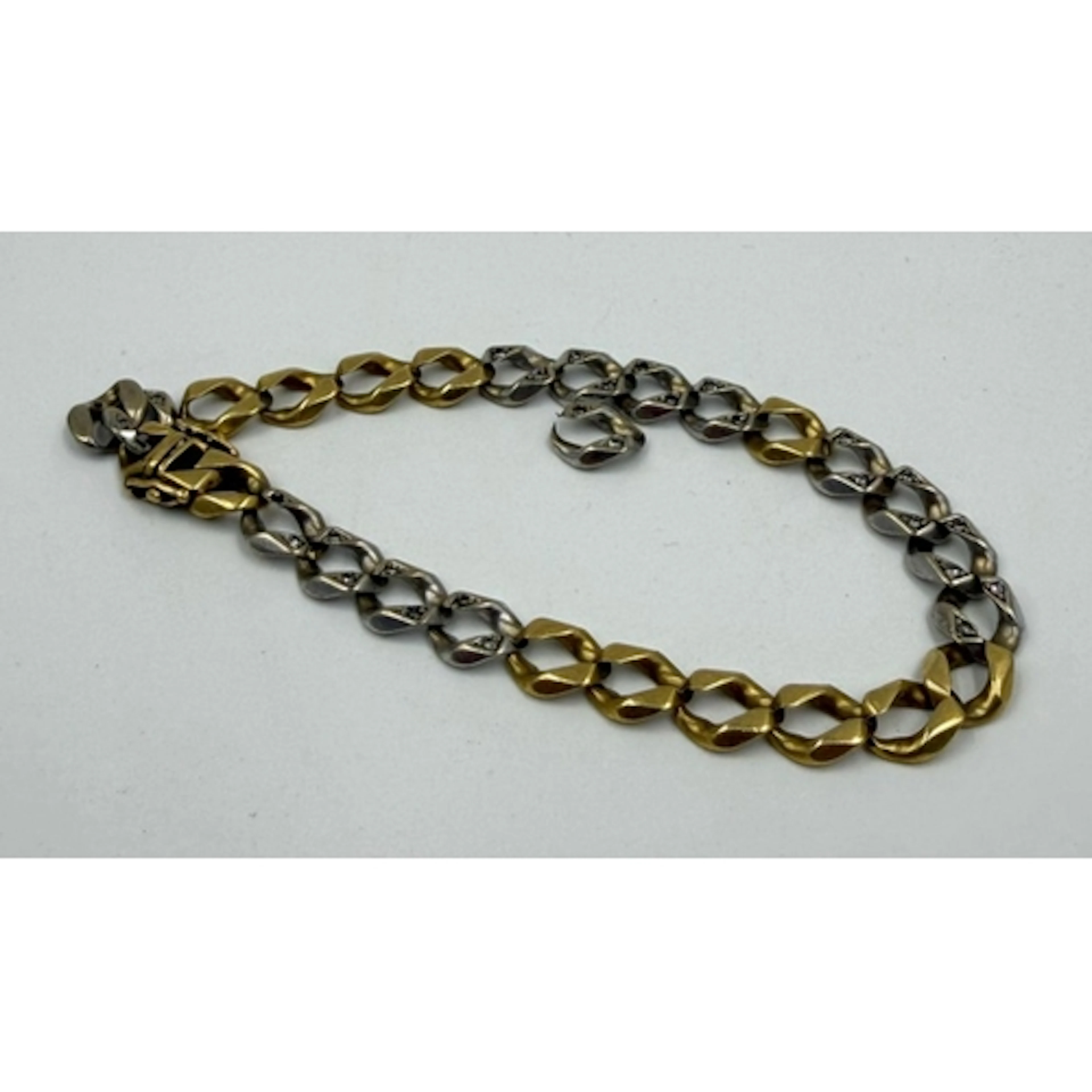 An 18ct gold bracelet AF with inset diamonds, approximate co...