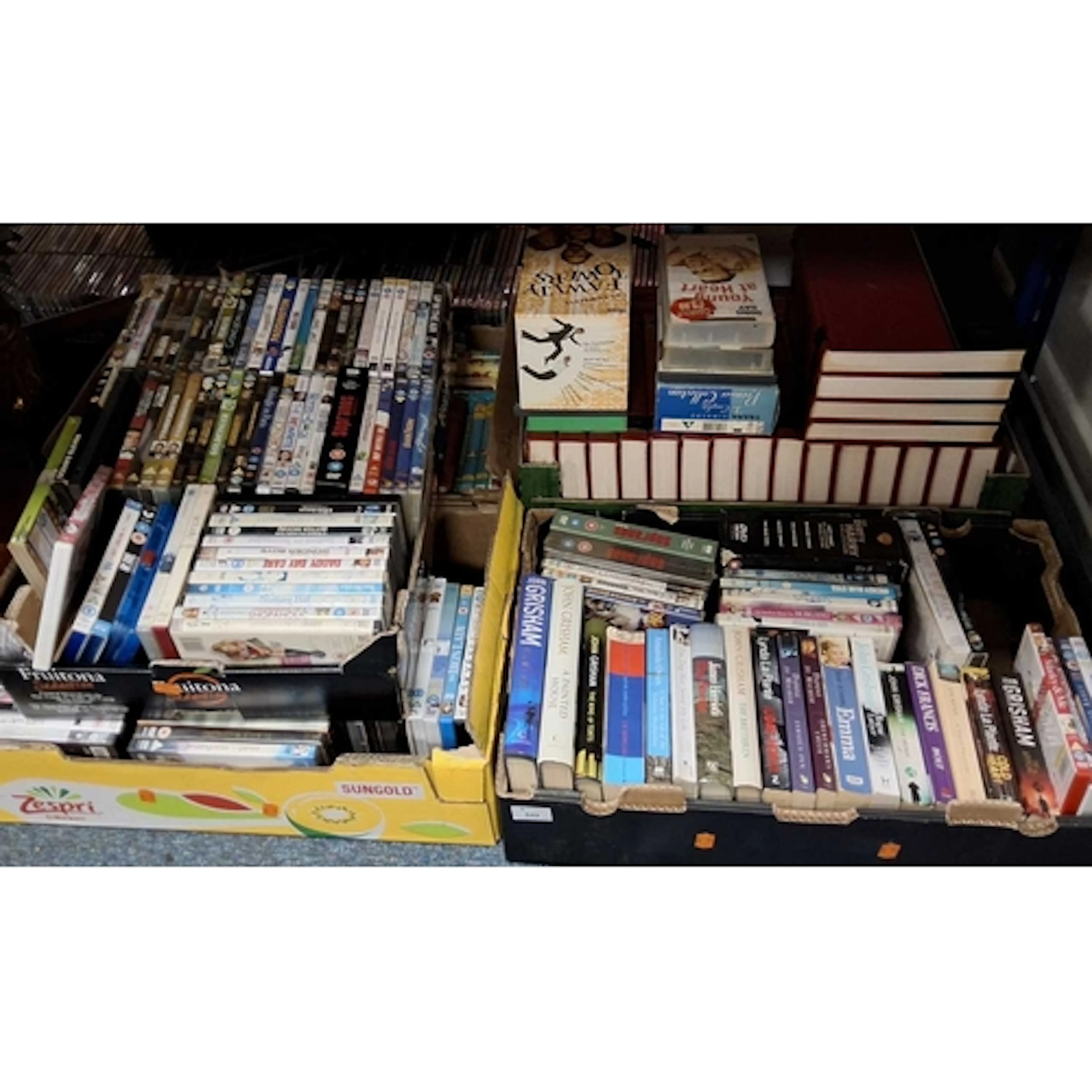 FIVE BOXES OF BOOKS AND DVDS, to include approximatly one hu...