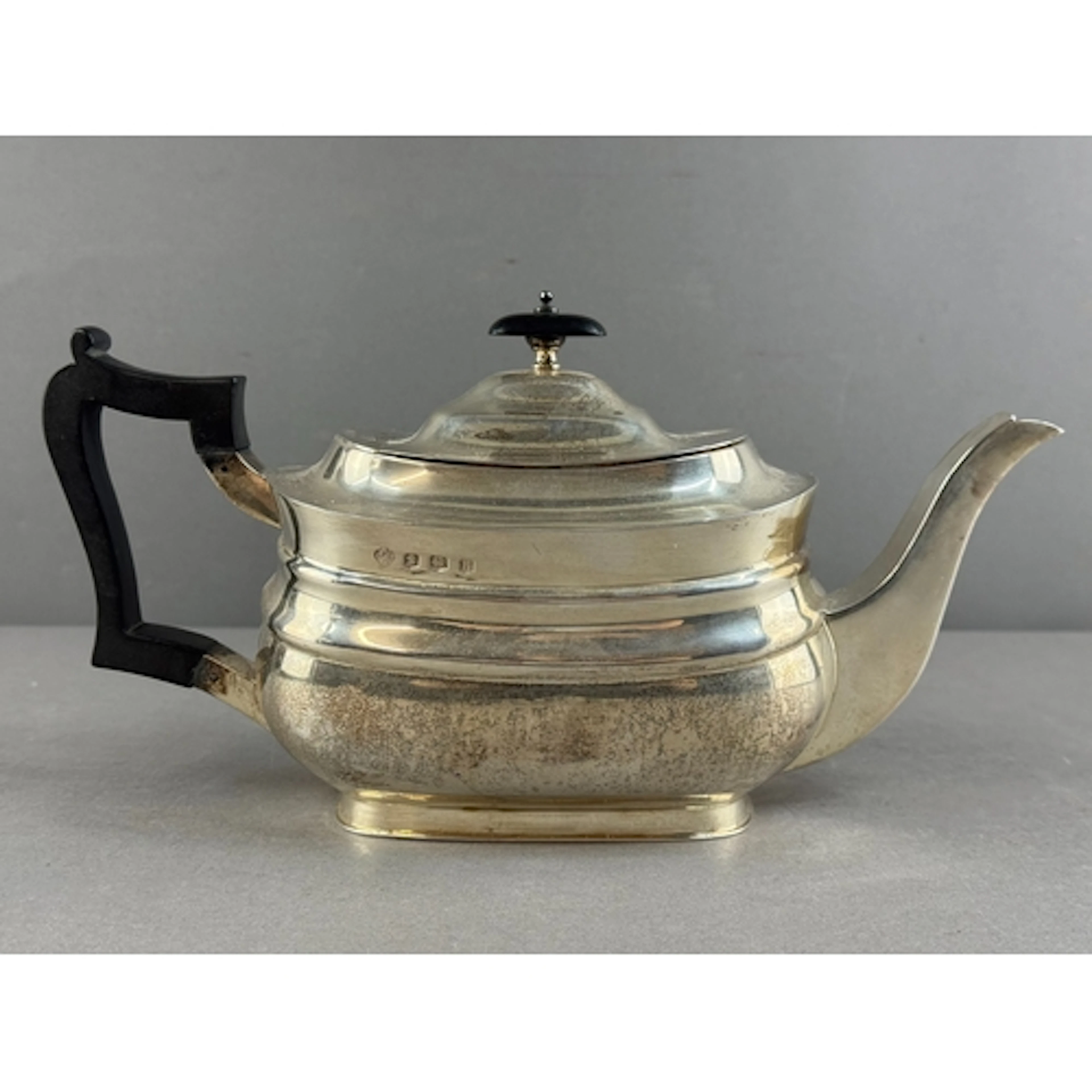 Silver: a stepped tier teapot with geometric spout, by Willi...