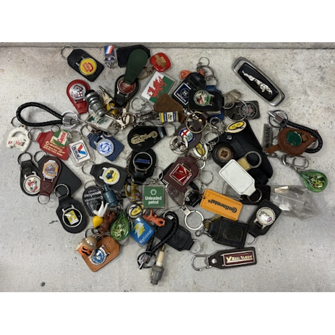 A collection of motoring related keyrings. Est. £20 - £30.