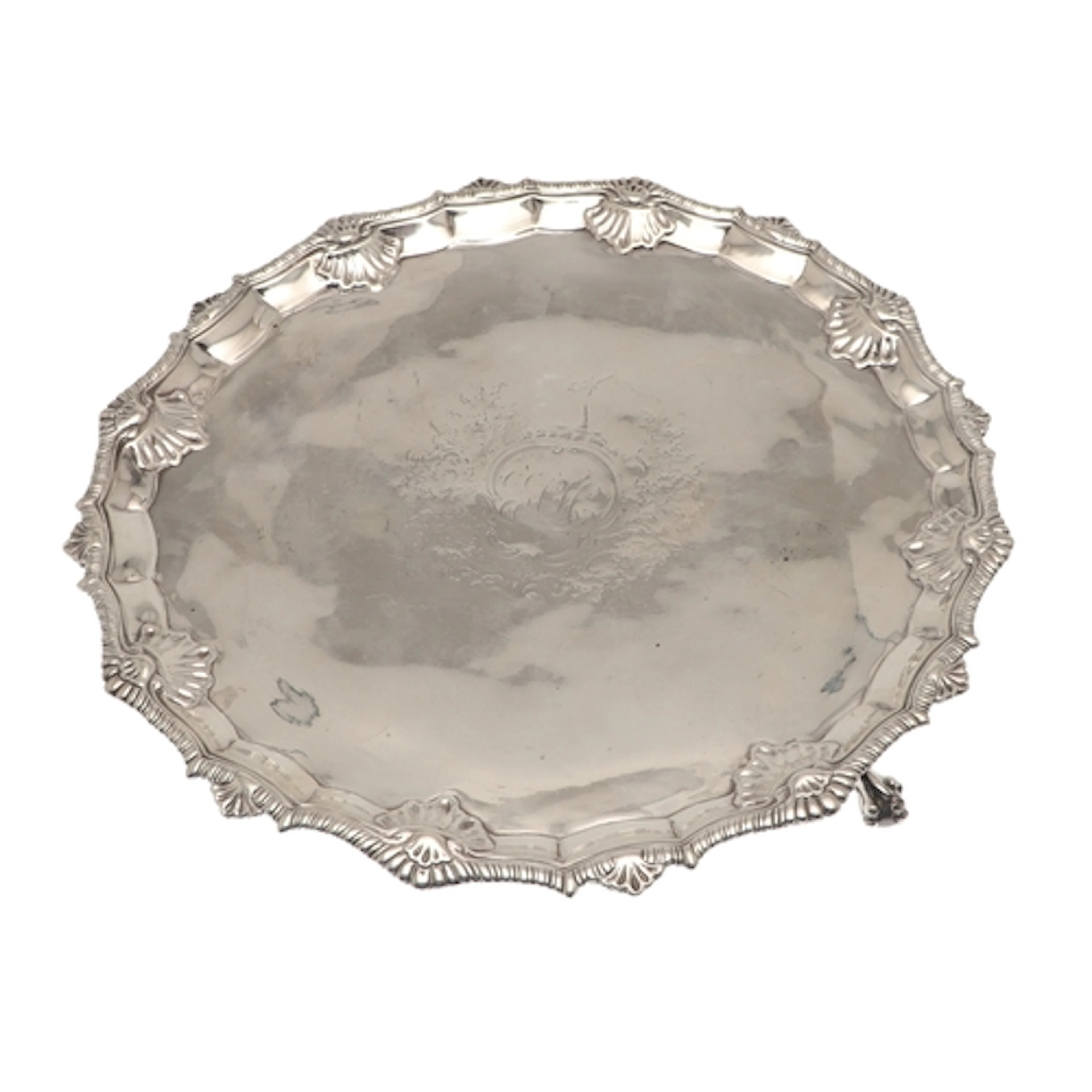 A GEORGE III SILVER SALVER. Of circular form, the border wit...