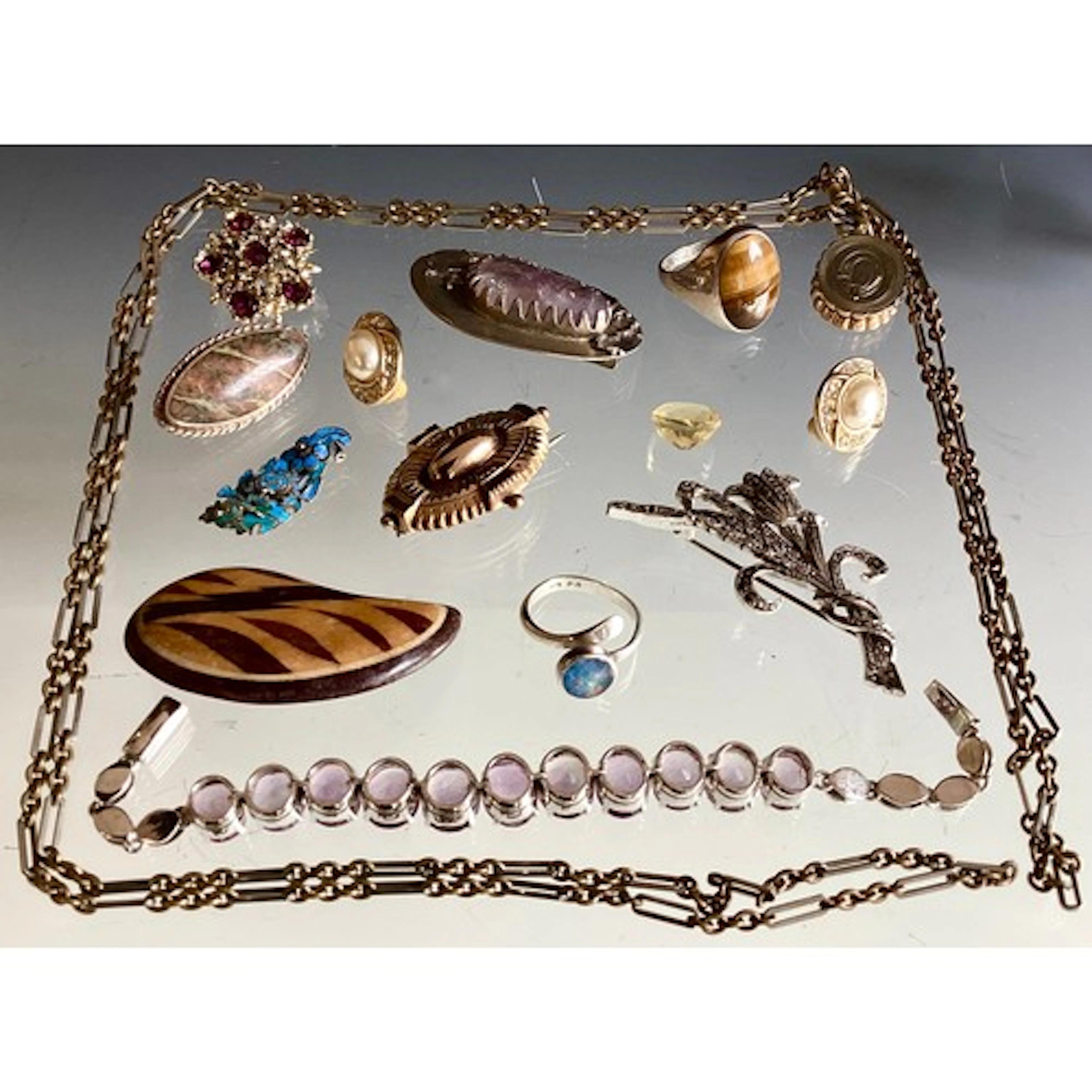 A selection of 9ct gold, silver and costume jewellery, the ...