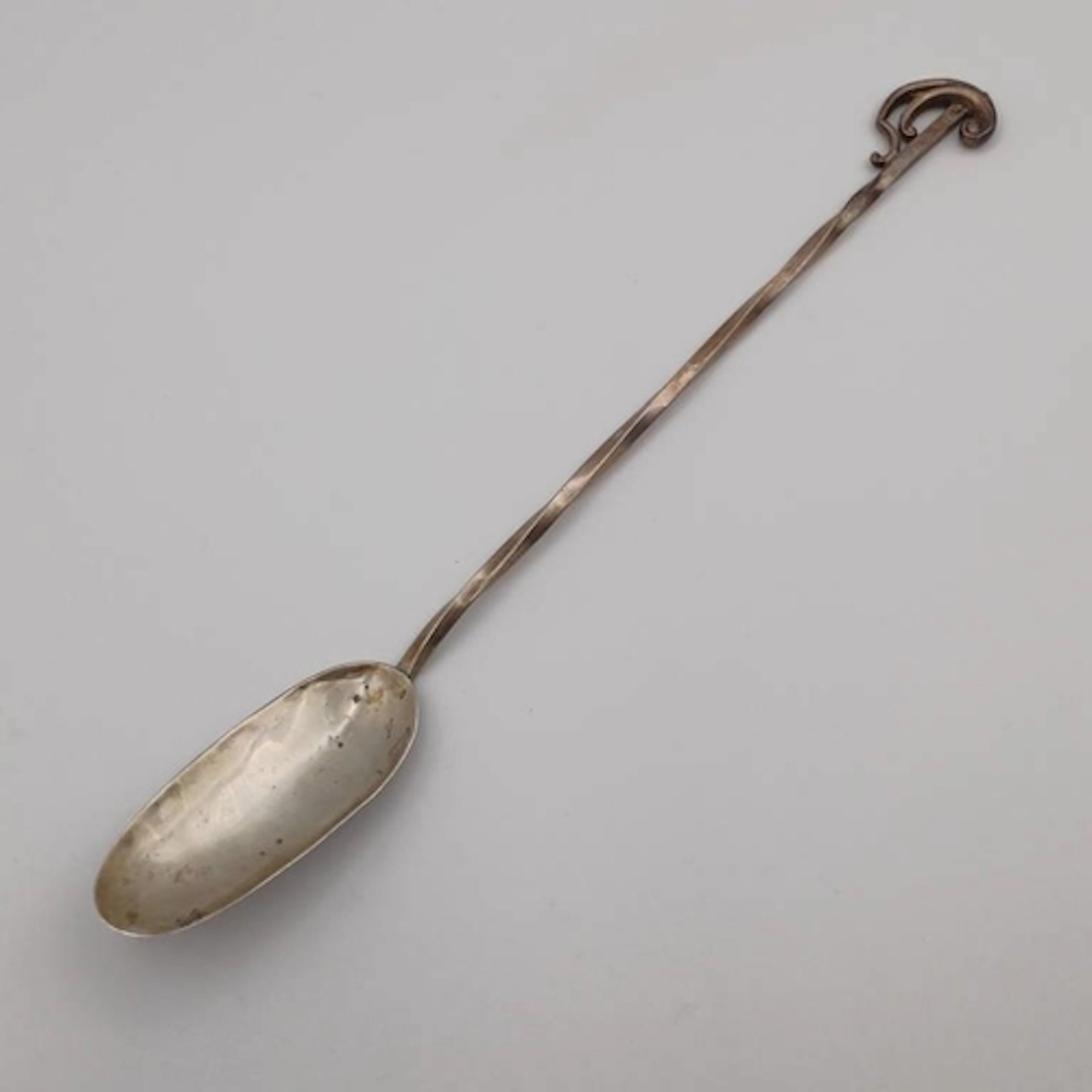 A SILVER ARTS & CRAFTS STYLE SPOON WITH LONG TWISTED HANDLE ...