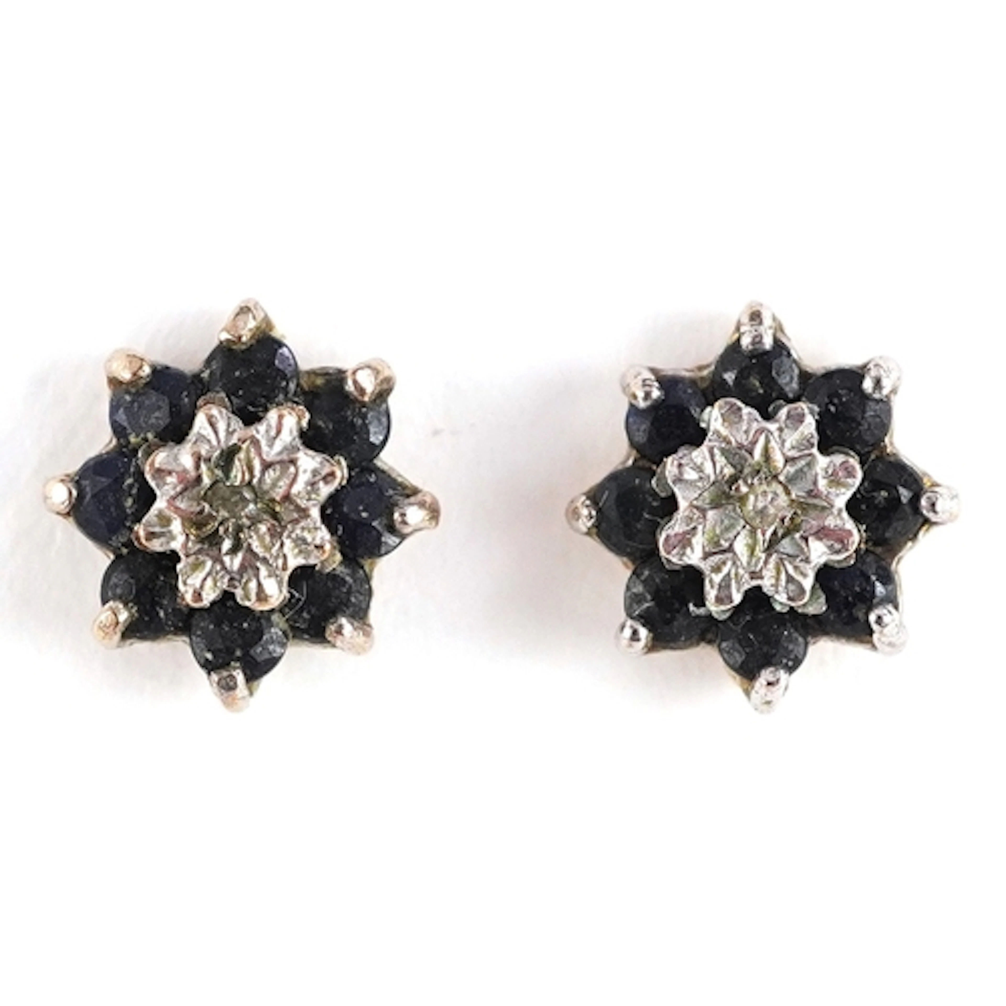 Pair of unmarked gold diamond and blue spinel cluster stud e...
