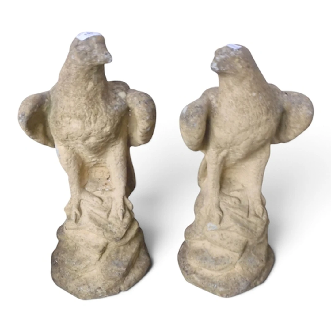A pair of 20th century reconstituted stone garden statues mo...