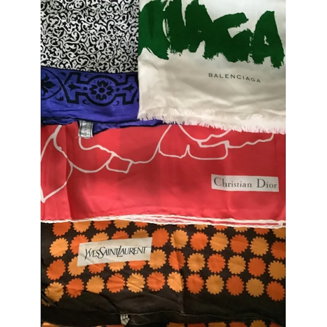 Four 20th century designer ladies silk scarves. Including: a...