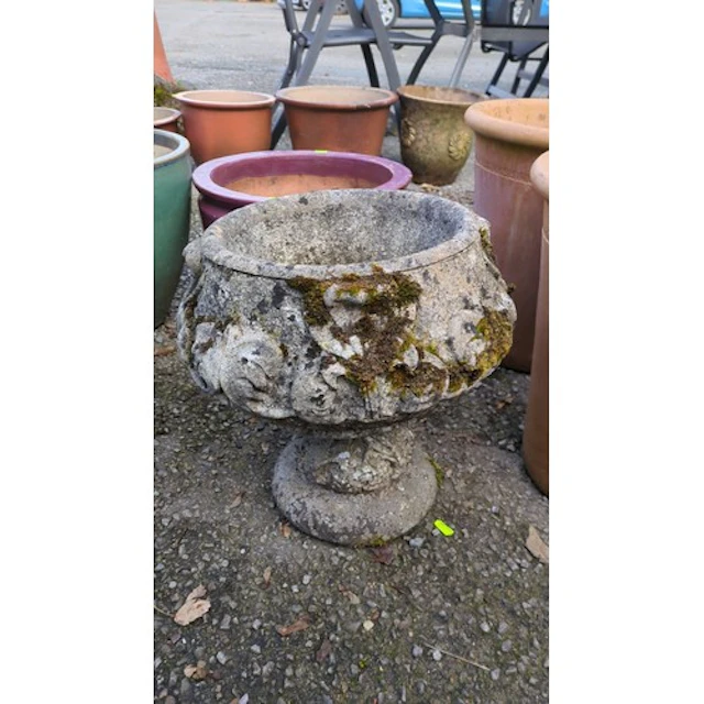 Cast-stone garden urn of circular form, the bowl decorated w...
