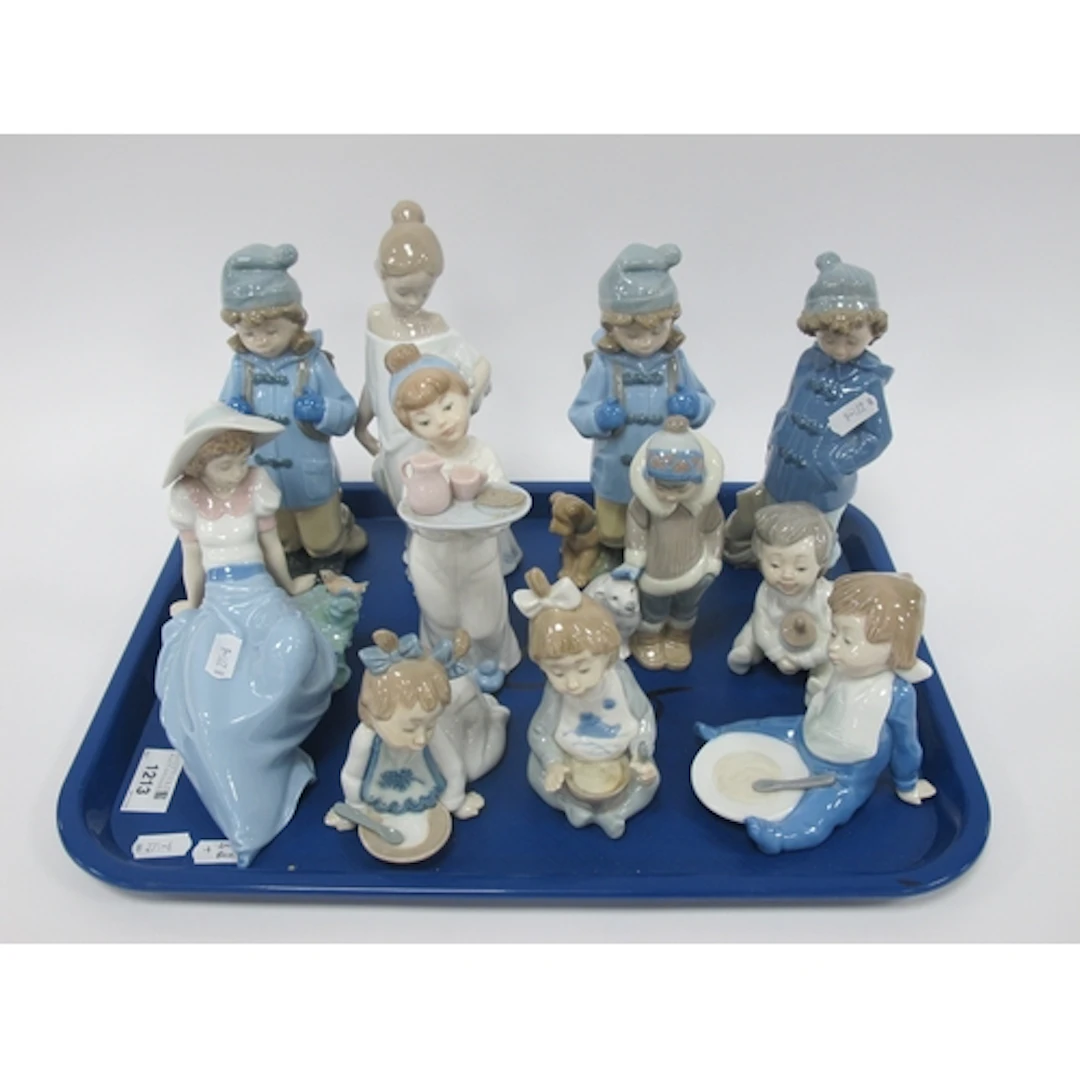 Eleven Lladro and NAO porcelain figures, including Lladro 52...