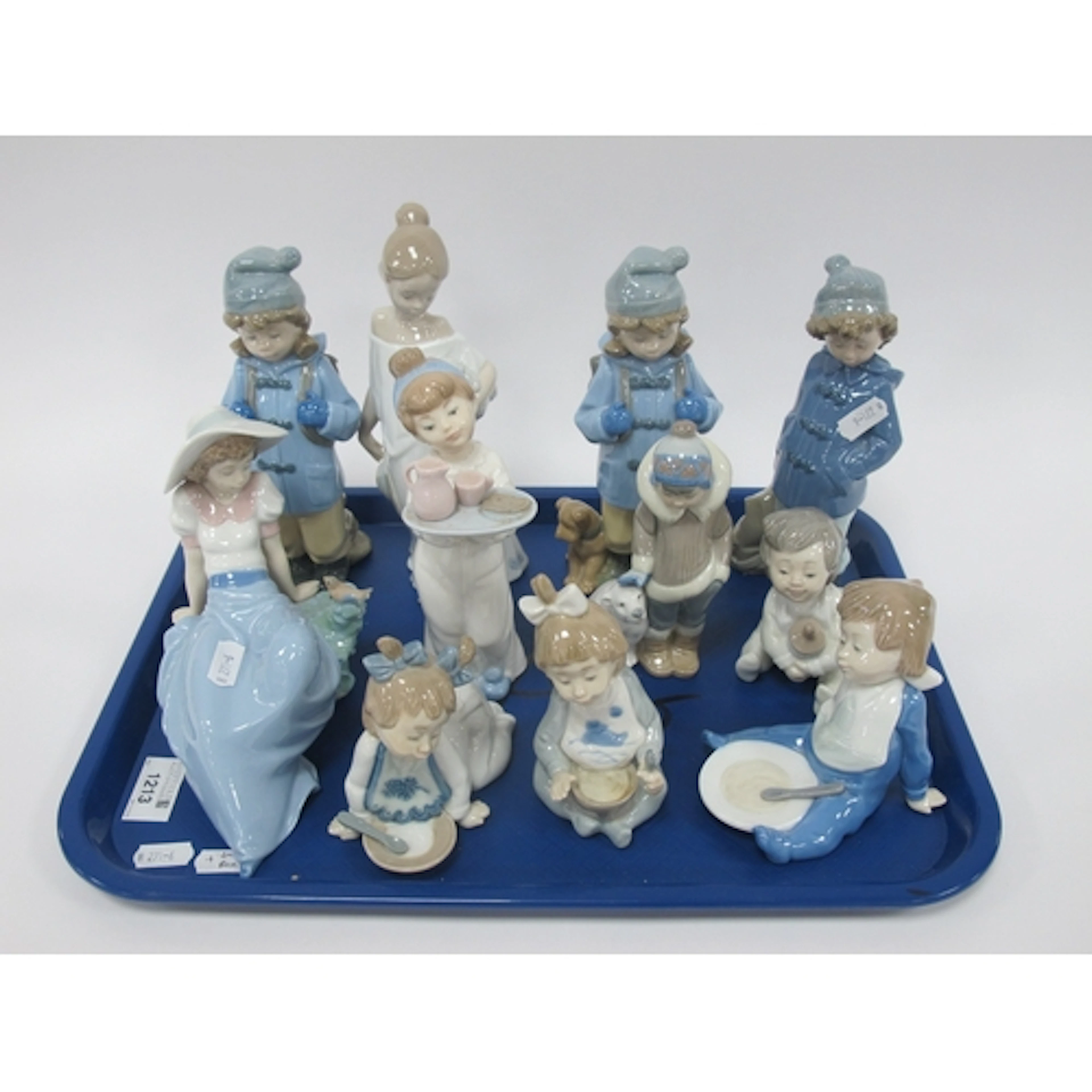 Eleven Lladro and NAO porcelain figures, including Lladro 52...