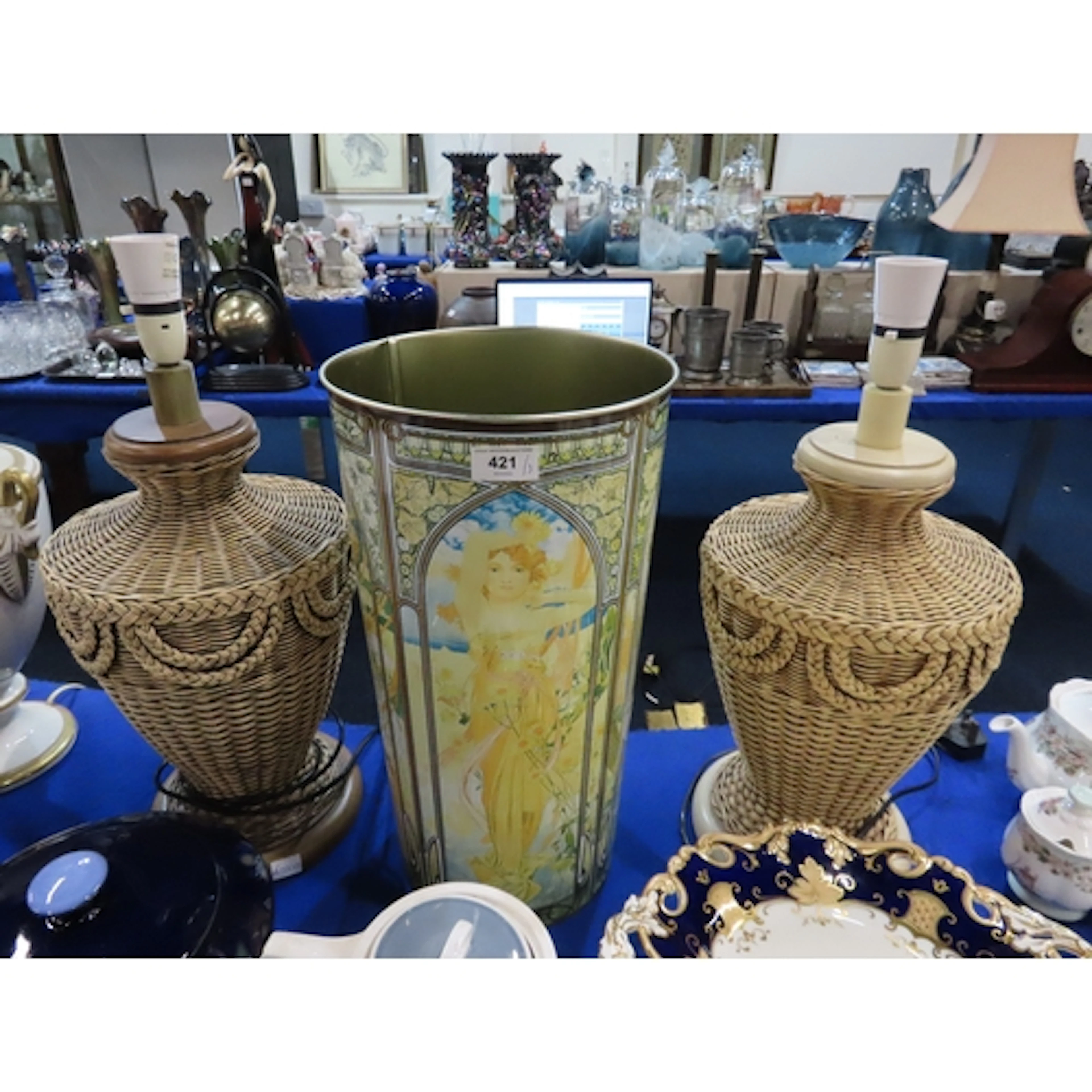 A pair of wicker effect table lamps and a Mucha style umbrel...