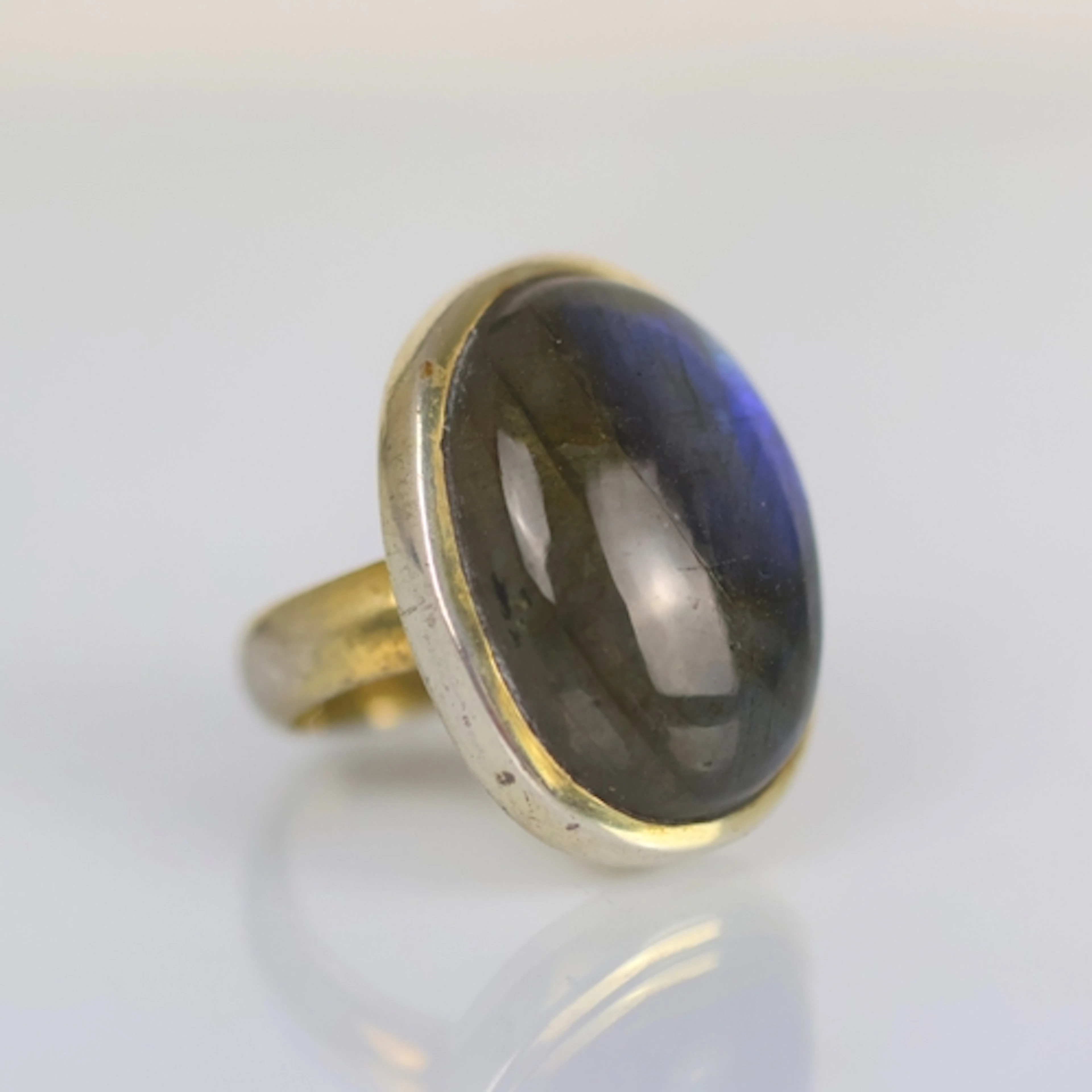 A contemporary labradorite ring, the cabochon oval labradori...