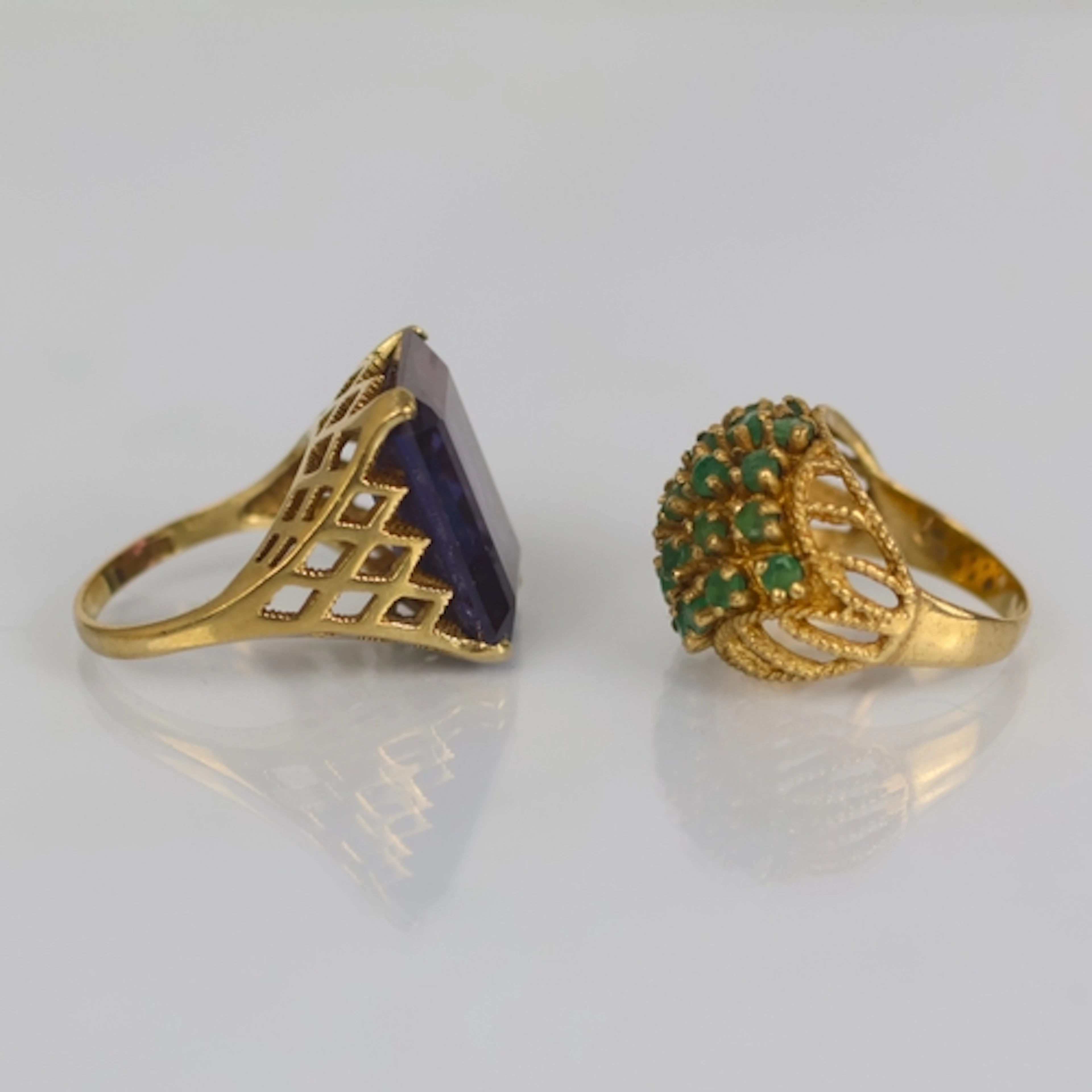 A contemporary amethyst cocktail ring, the emerald cut stone...