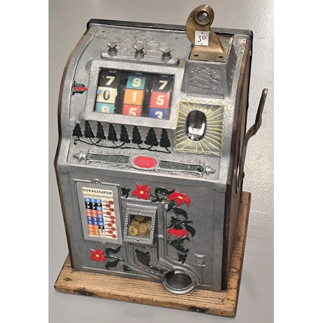 A Mills Poinsettia slot machine, one arm bandit, c.1929, wor...