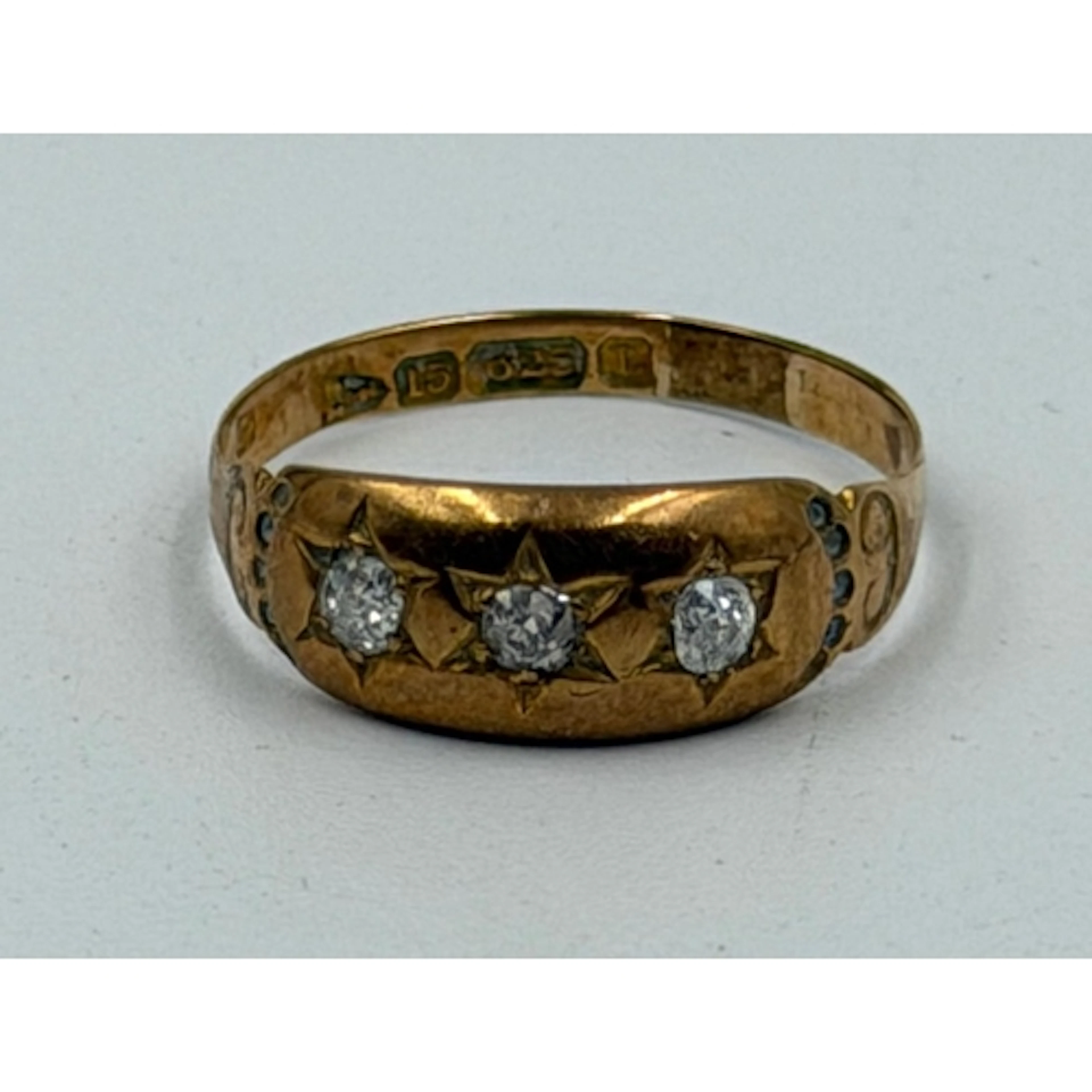 A 15ct yellow gold ring set with three star diamonds, approx...