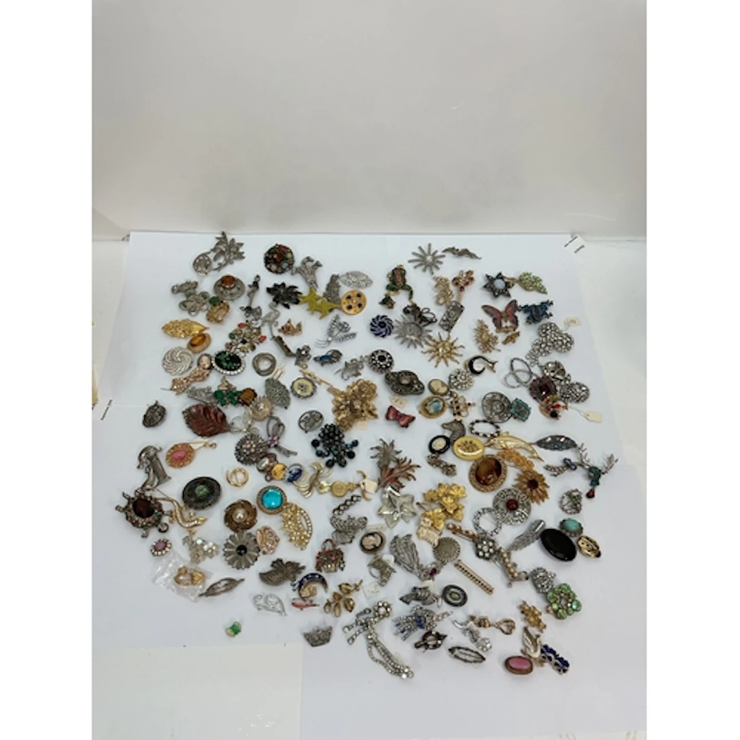 A large collection of vintage brooches including some signed...