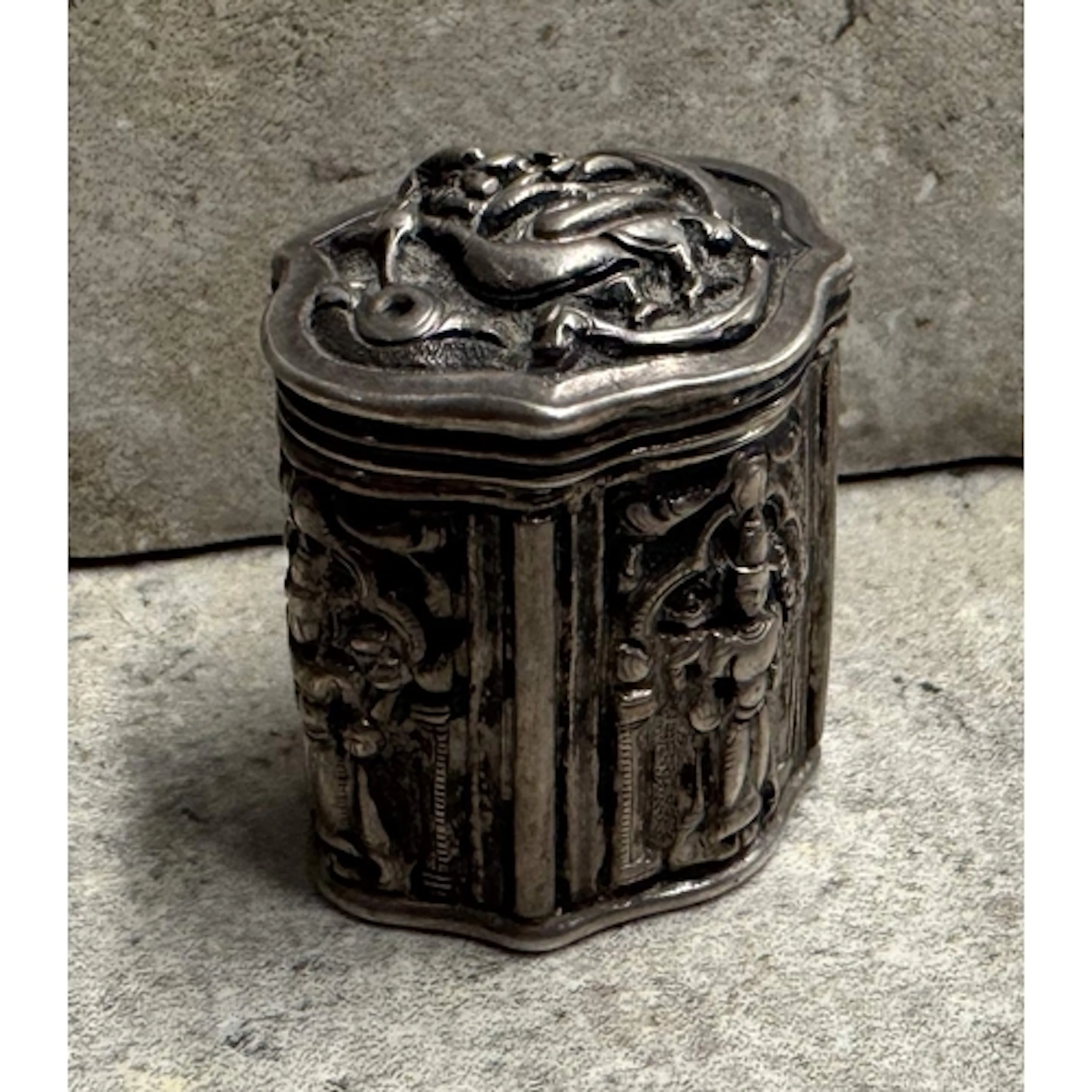 An Antique Continental silver hinged-top box with chased dec...