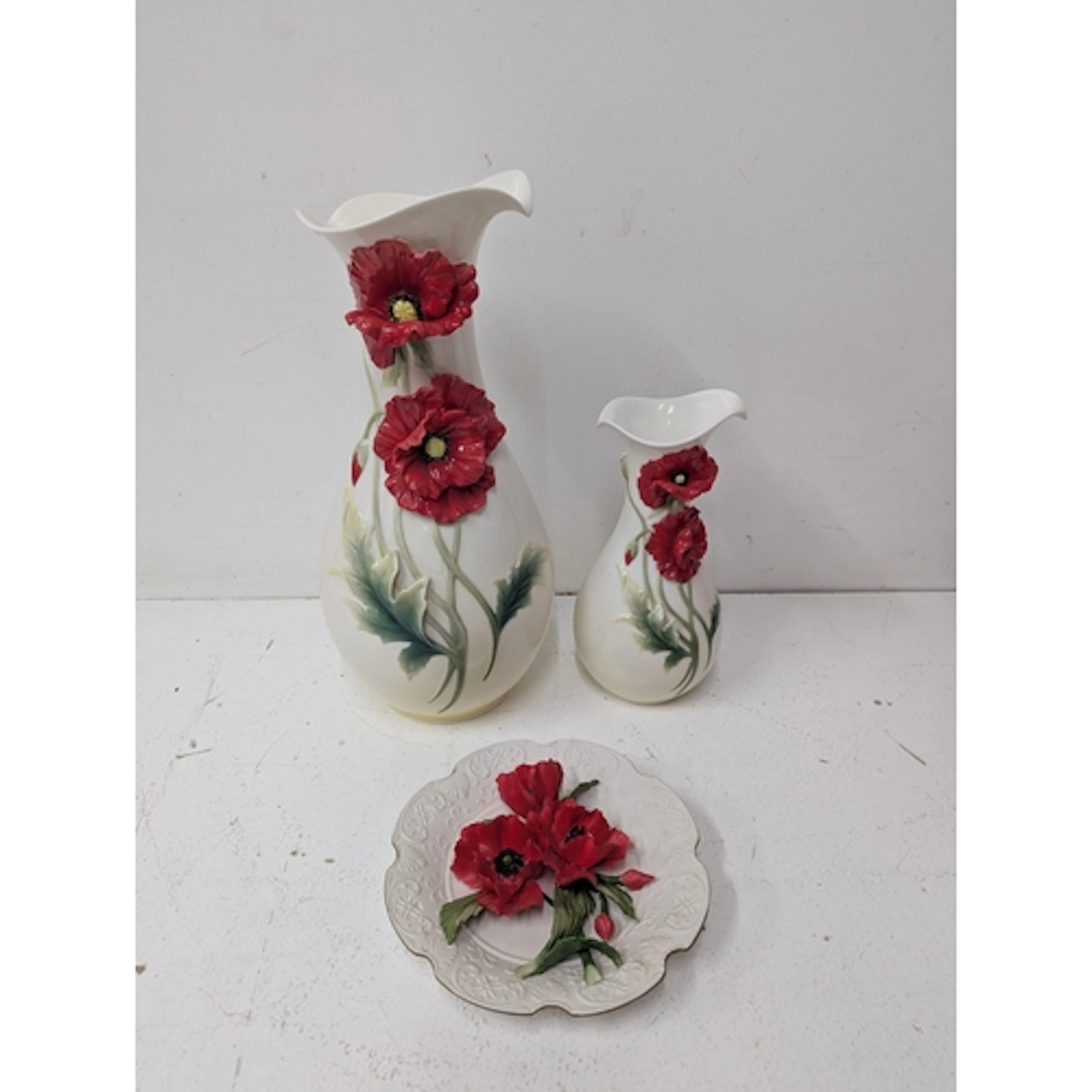 A Franz porcelain poppy vase together with a smaller matchin...