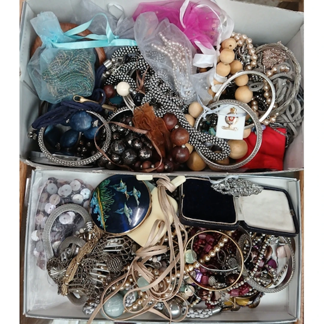 A box of assorted costume jewellery.