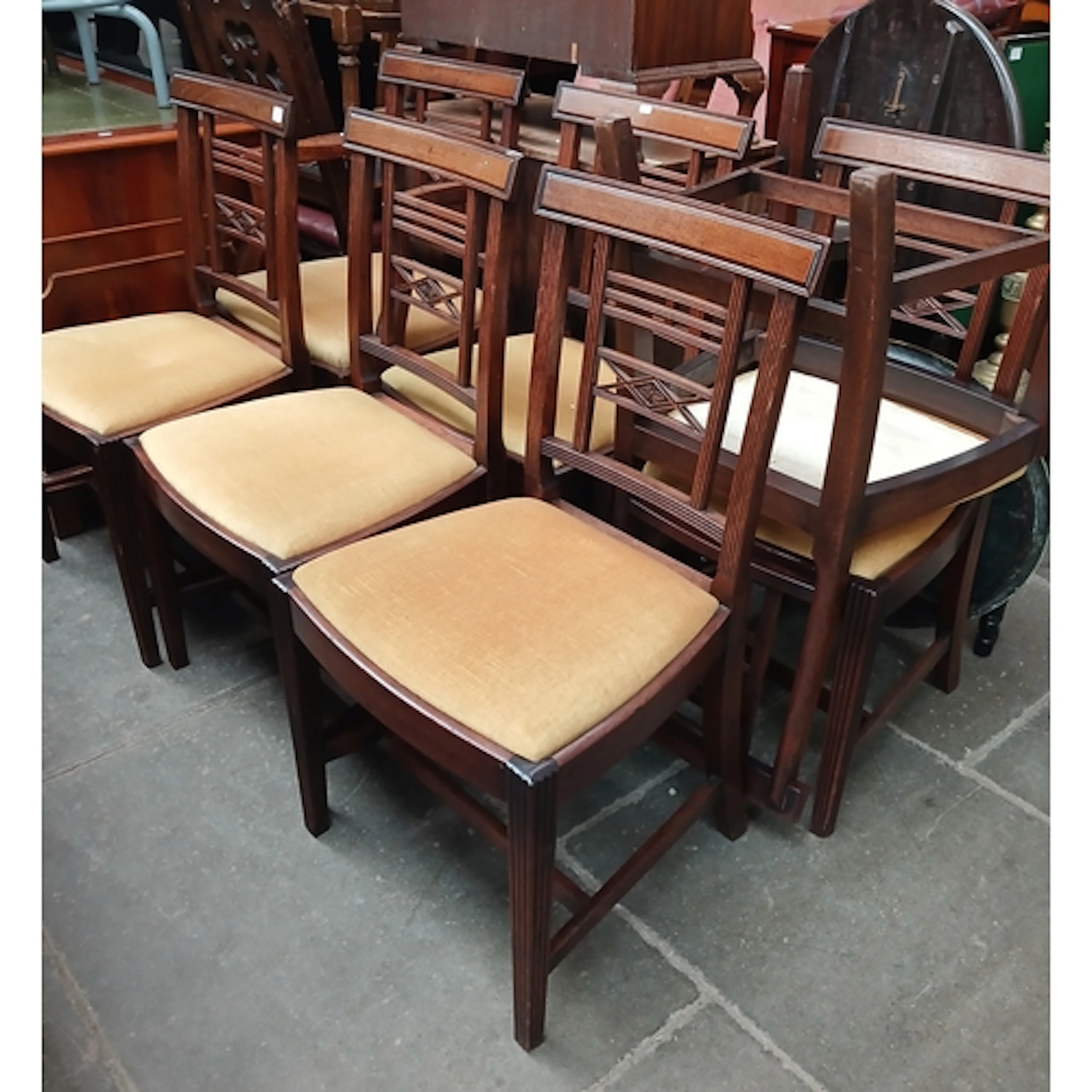 A set of seven George III mahogany dining chairs.